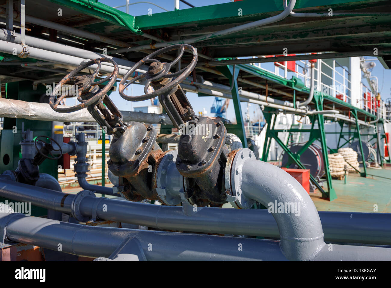Valves and pipeline for loading liquid cargo on an oil-chemical tanker  Stock Photo - Alamy