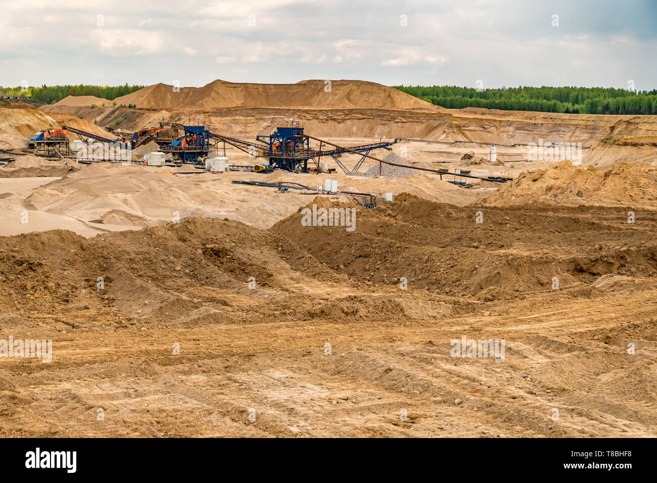 huge digger in quarry for sand extraction mining Stock Photo - Alamy