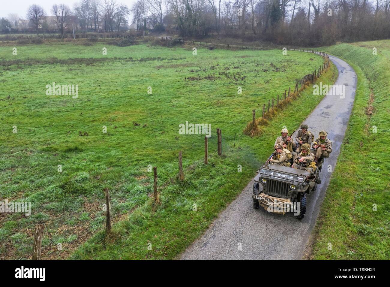 France, Eure, Sainte Colombe prÚs Vernon, Allied Reconstitution Group (US World War 2 and french Maquis historical reconstruction Association), reenactors in uniform of the 101st US Airborne Division progressing in a jeep Willys (aerial view) Stock Photo