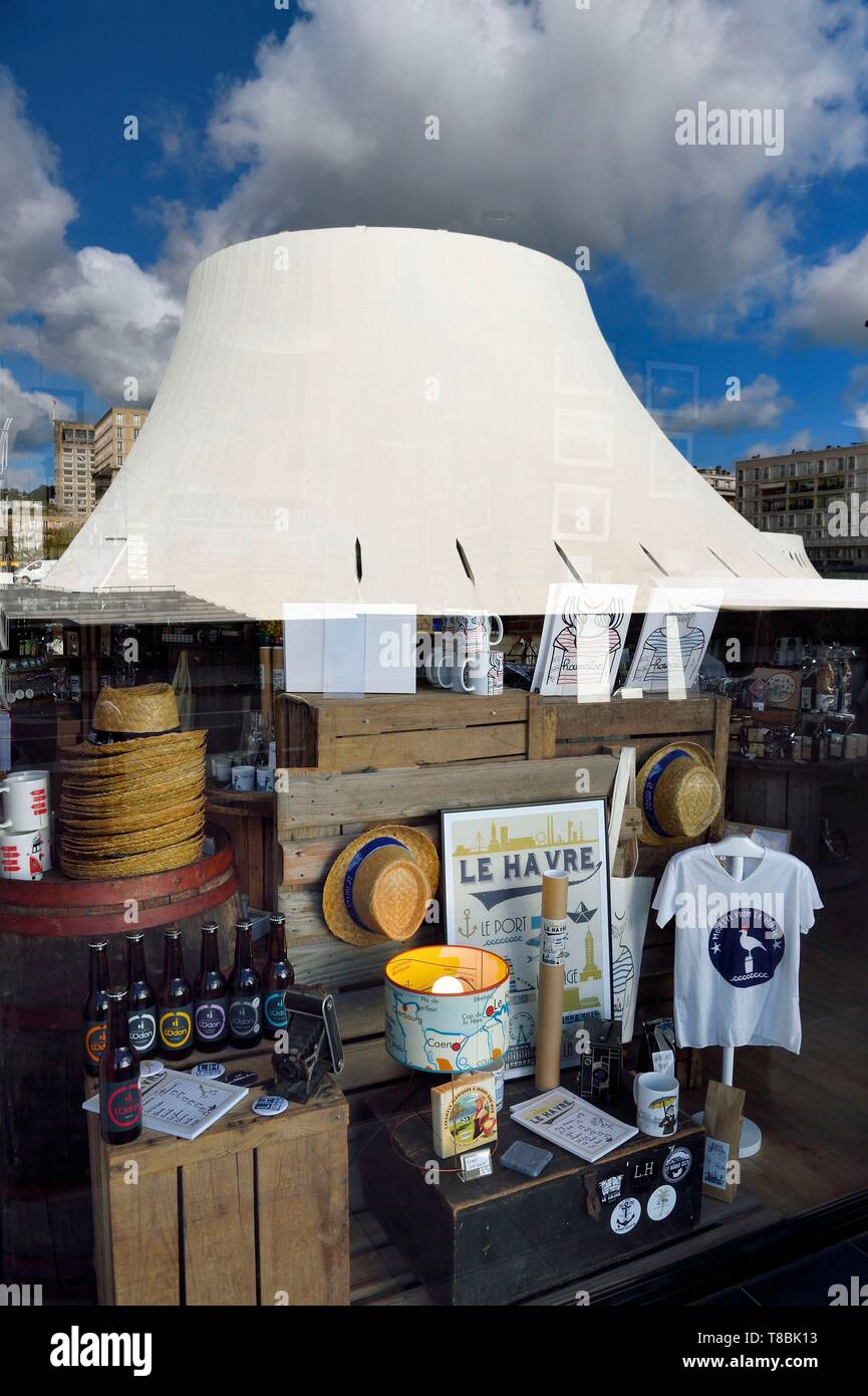 France, Seine Maritime, Le Havre, Downtown rebuilt by Auguste Perret listed as World Heritage by UNESCO, the cultural center called Volcano created by Oscar Niemeyer is reflected in the shop window LoHo The Local sHop Stock Photo