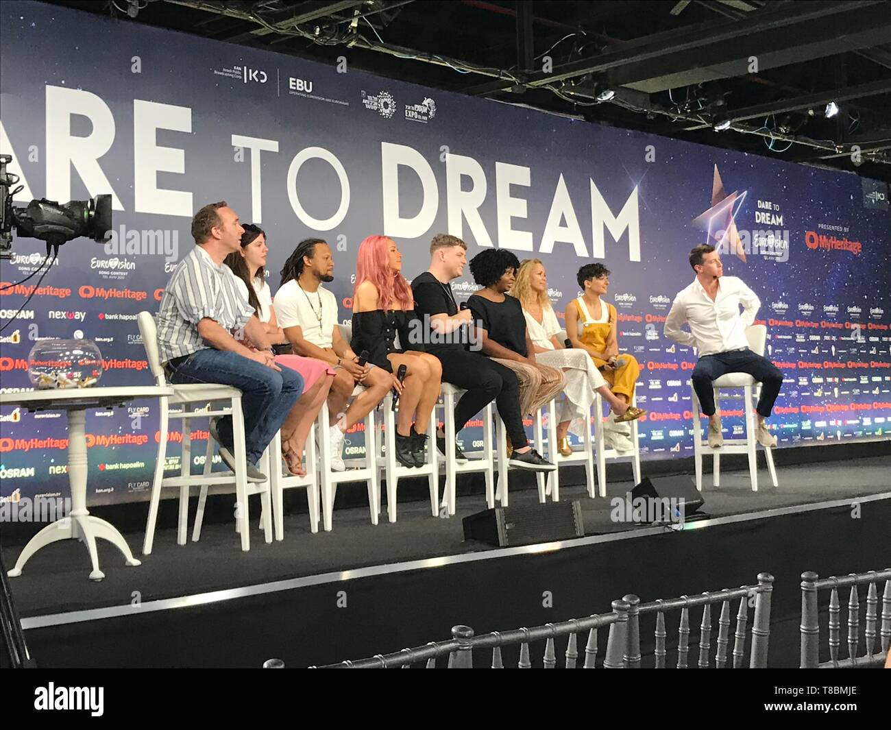 Michael Rice (centre) with his backing singers and PR team during a press conference at the Expo Tel Aviv in Israel. Stock Photo