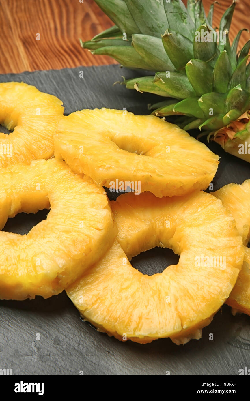 Canned pineapple rings on slate plate Stock Photo - Alamy