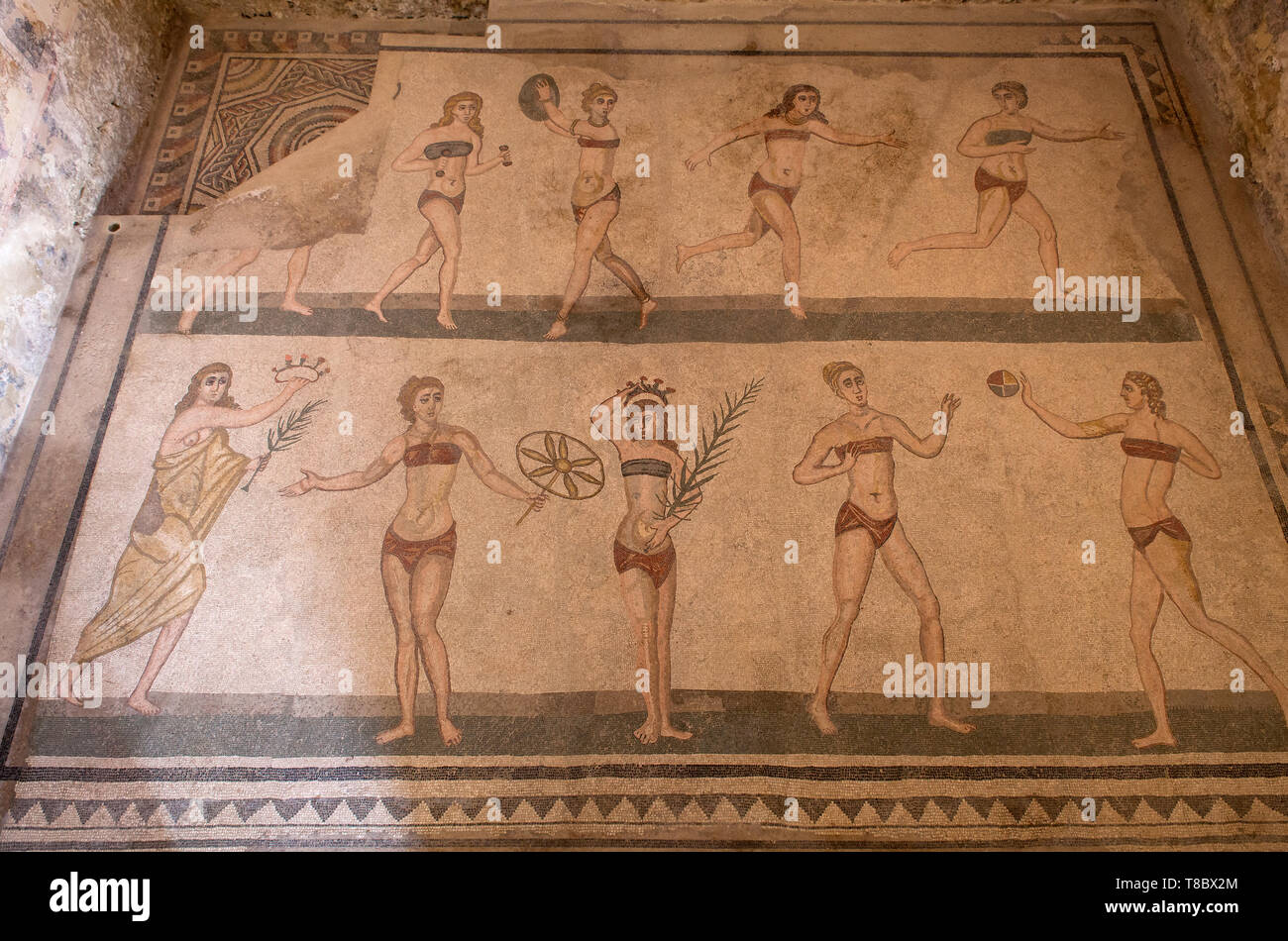 PIAZZA ARMERINA, ITALY - APRIL, 24: The 'bikini' mosaic, showing women playing sports. Villa Romana del Casale, large and elaborate Roman villa  desig Stock Photo