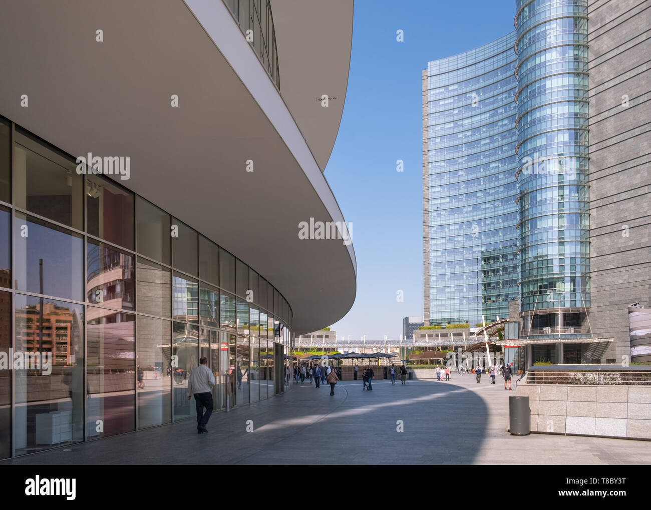 Piazza Gae Aulenti, part of Milan's Porta Nuova regeneration project, featuring modern architecture and shopping. Stock Photo