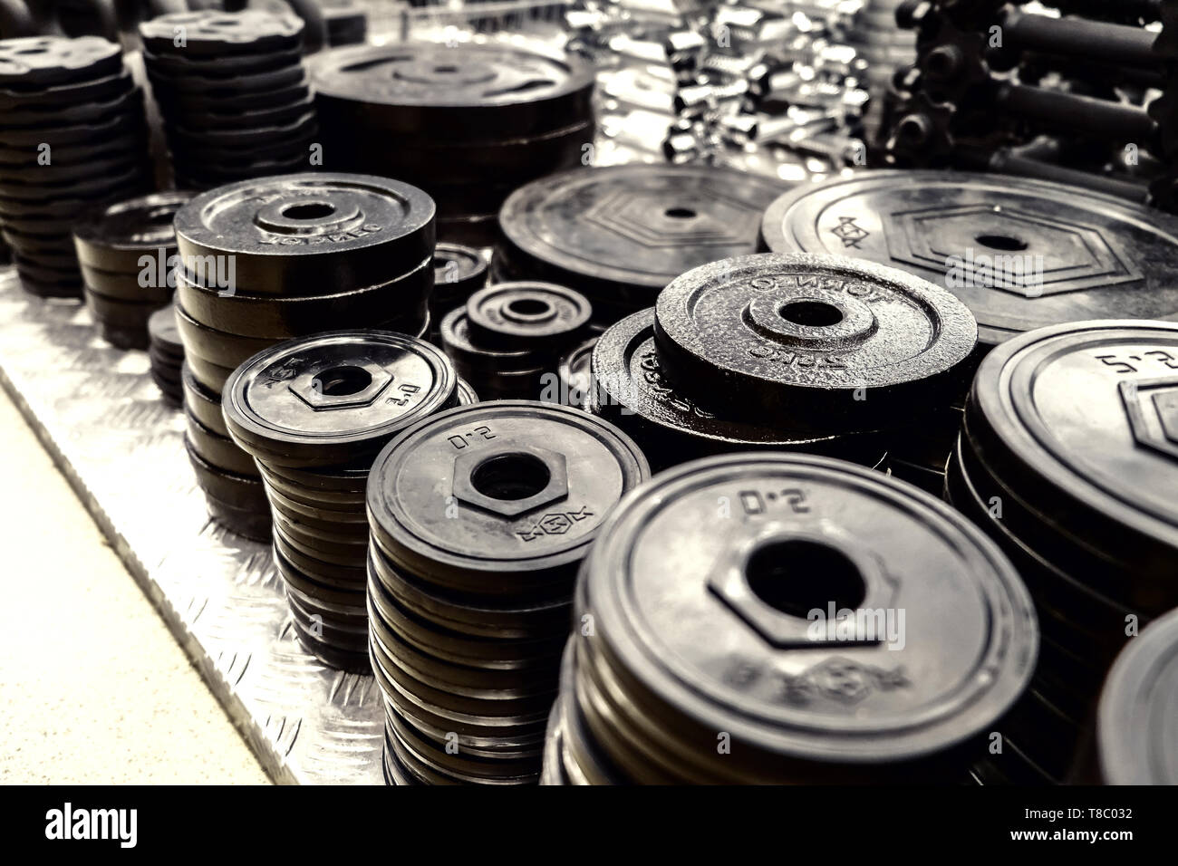 sports equipment, weights. a gym Weights, and stationary equipment Stock Photo Alamy