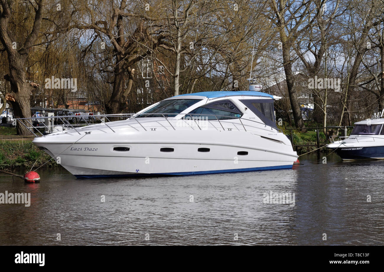 Cabin cruiser Lazi Daze moored on the River Avon at Christchurch, Dorset Stock Photo