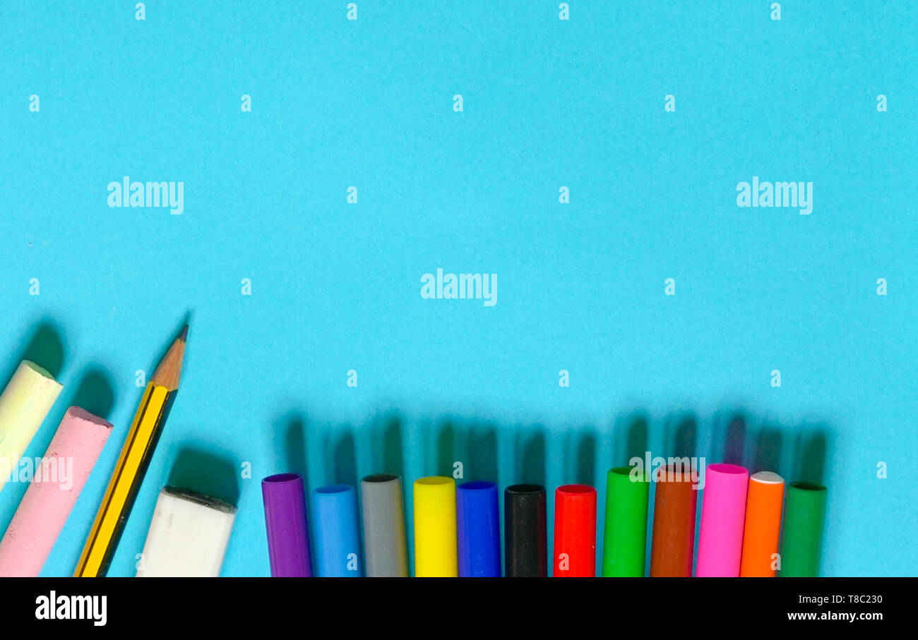 Education or back to school concept : top view or flat lay of chalks, pencil,  magic colors, eraser, oil pastels, scissors, notebook with copy space Stock  Photo - Alamy