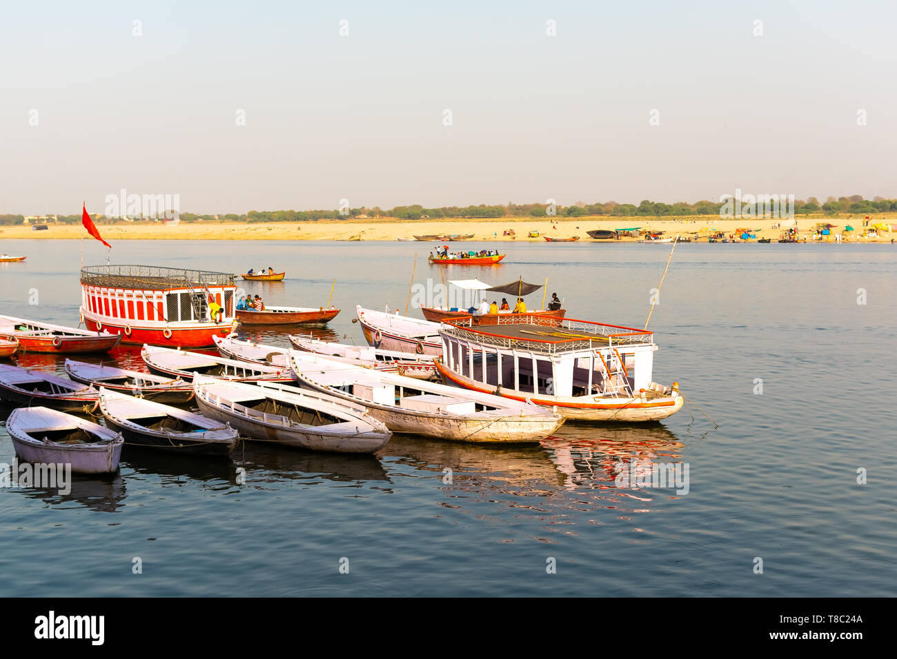 Colorful boats on Ganges river in Varanasi, India. Stock Photo