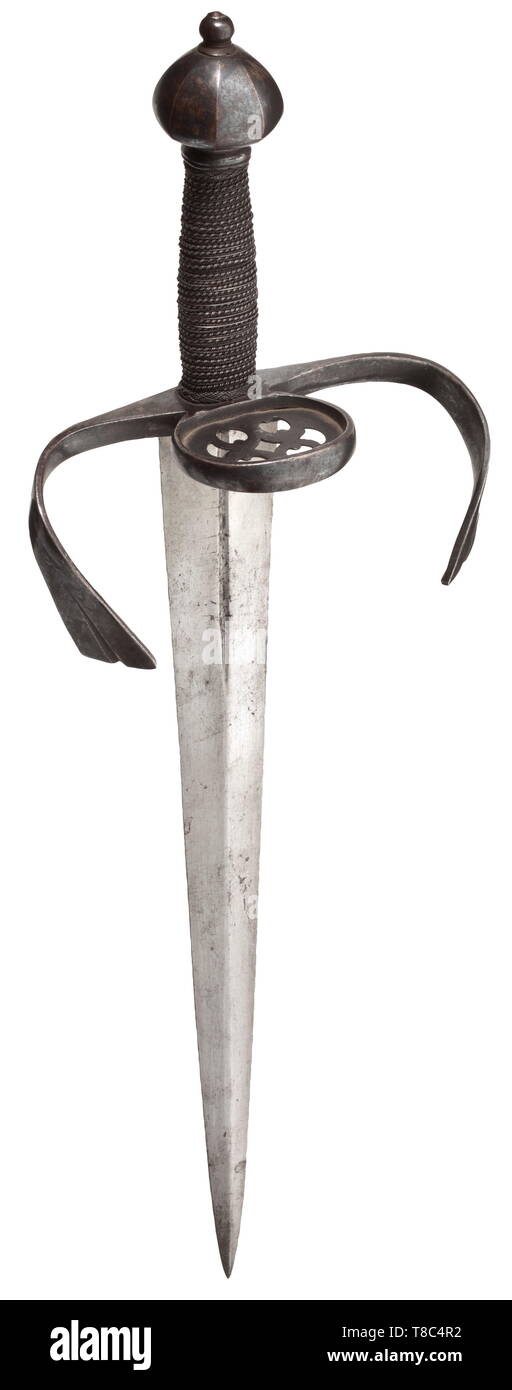 A fine left-hand dagger carried by the Trabantenleib-Garde of the Prince Electors of Saxony late 16th century. With tapering double-edged blade of flattened diamond section cut with a narrow fuller on both sides below the hilt, iron hilt retaining most of its original bright blue-black finish, strongly arched forward-swept flat quillons with fluted widening tips, ring-guard filled with a sprung-in plate pierced with a bold pattern involving pairs of conjoined opposing C-scrolls, domed octagonal pommel rising to a button, and the grip retaining it, Additional-Rights-Clearance-Info-Not-Available Stock Photo