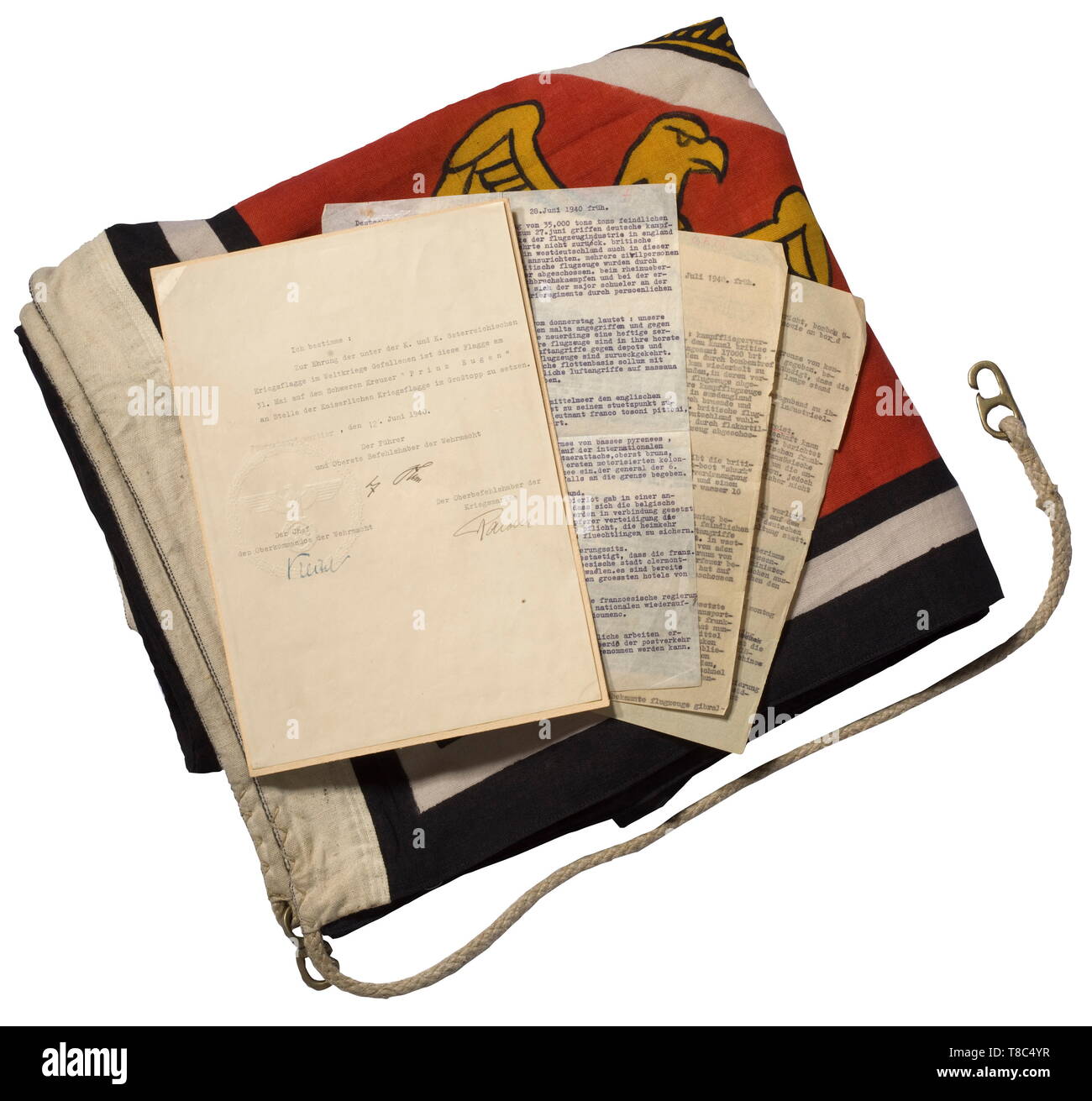 A Führer standard from the heavy cruiser 'Prinz Eugen' Colour-imprinted naval flag cloth, the left side lettered 'Stand. d. Führ. 1,5 x 1,5' with naval acceptance stamp. Colour-fresh, slightly stained, small moth traces. Included is the flag display decree for the 'Prinz Eugen' for the future memorial days of the Battle of Jutland (tr) 'In honour of those who were killed in action in the World War under the imperial and royal Austrian war flag, on 31 May this flag is set on the main topmast instead of the imperial war flag aboard the heavy cruiser 'Prinz Eugen´. Führer H 20, Editorial-Use-Only Stock Photo