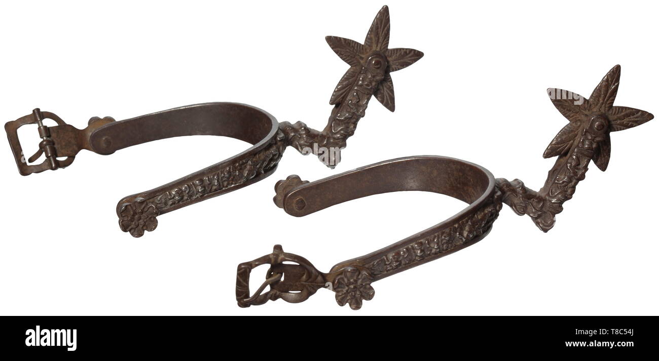 A Pair Of High Quality Chiselled Rowel Spurs South German Or Italian Circa 16 Wrought Iron Spurs With Chiselled High Relief Of Fighting Horsemen Between Grotesques And Mascarons On The Front Side Five Pointed Star A Pair Of High Quality Chiselled Rowel Spurs South German Or Italian Circa 16 Wrought Iron Spurs With Chiselled High Relief Of Fighting Horsemen Between Grotesques And Mascarons On The Front Side Five Pointed Star