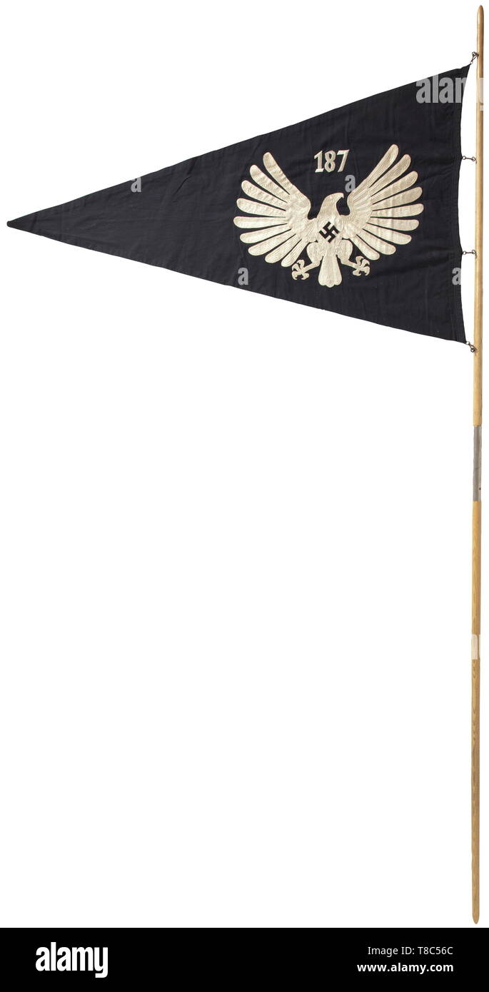 A Young GirlsÂ´ League Untergau pennant for Untergau '187' (Ostholstein/Nordmark area) with the rare flagpole, circa 1938 Black navy flag cloth with national eagle on both sides and Untergau number '187' in white chain stitch embroidery. Beautiful condition. Dimensions approximately 76 x 126 cm. The snap hooks corroded. Two-piece flagpole made from oak with RZM marking 'RZM 23/27' above the iron insertion sleeve. Total length 247 cm. Extremely rare. historic, historical, 20th century, 1930s, League of German Girls, Band of German Maidens, youth organization, youth organizat, Editorial-Use-Only Stock Photo