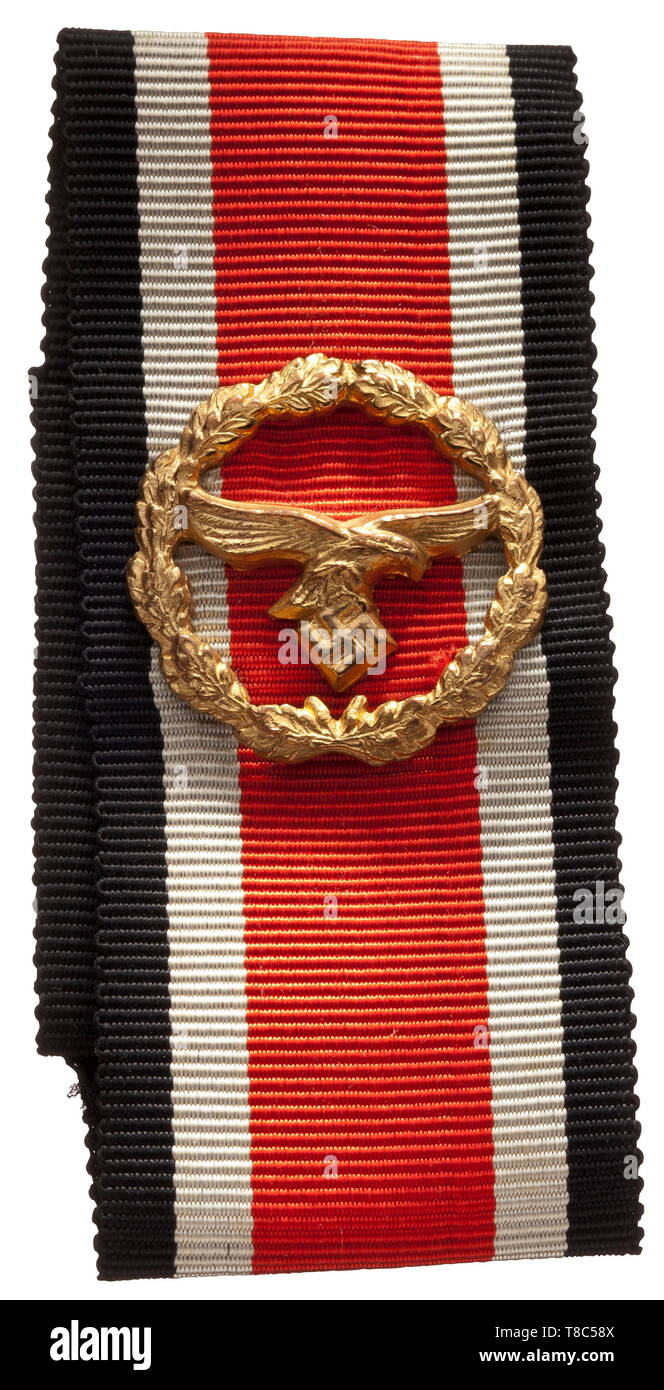 An Honour Roll Clasp of the German Luftwaffe Hollow stamped non-ferrous metal, fire gilt with polished edges, reverse with four attachment pins. The orders ribbon is in its complete length of 30 cm. An unquestionably contemporary piece in a mint state of preservation. historic, historical, awards, award, German Reich, Third Reich, Nazi era, National Socialism, object, objects, stills, medal, decoration, medals, decorations, clipping, cut out, cut-out, cut-outs, honor, honour, National Socialist, Nazi, Nazi period, 20th century, Editorial-Use-Only Stock Photo