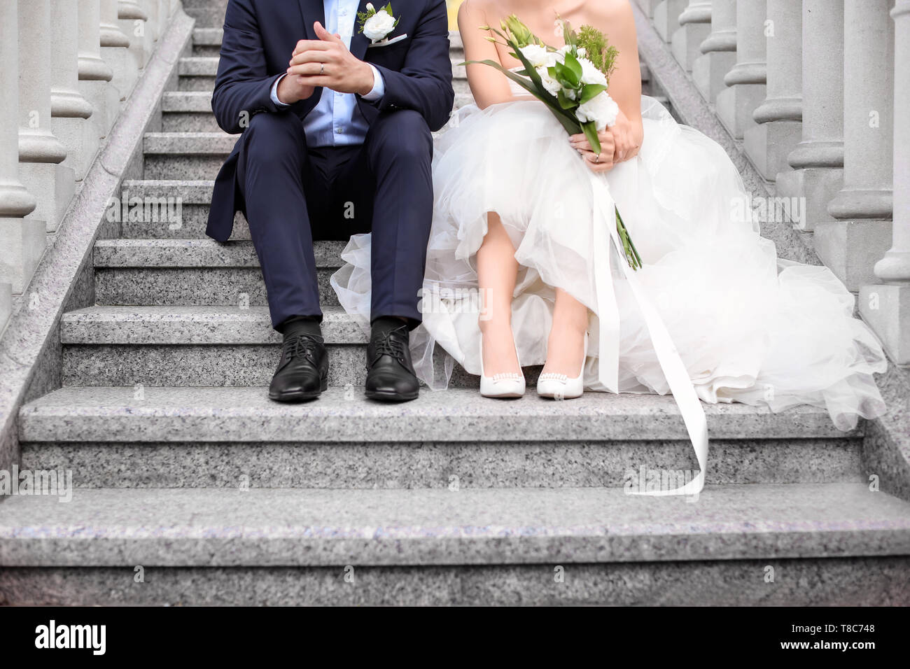 Bride sitting on stairs hi-res stock photography and images - Alamy