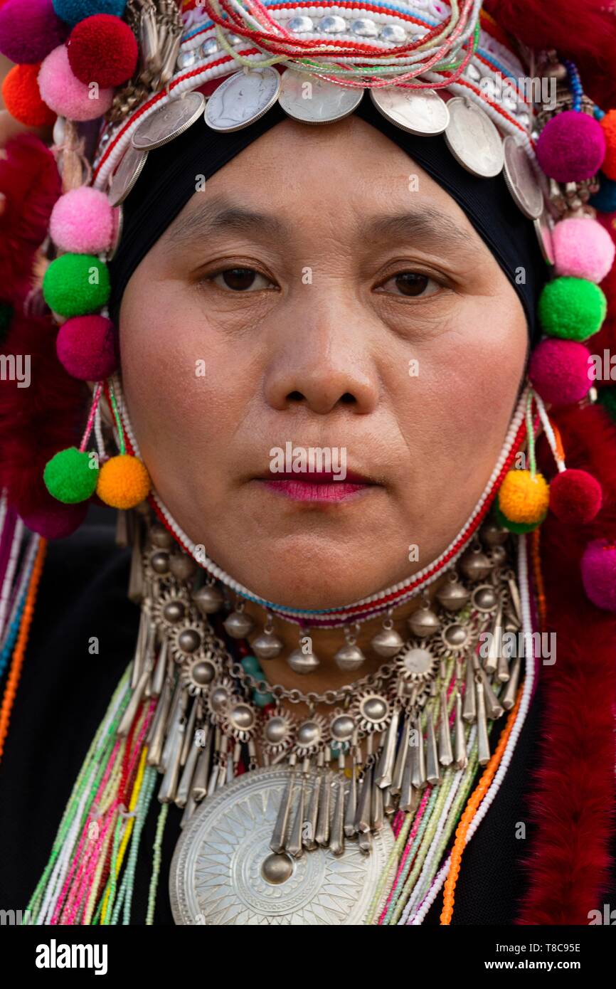 Akha woman with headdress, headgear with silver coins, traditional clothes, portrait, province Chiang Rai, Northern Thailand, Thailand Stock Photo