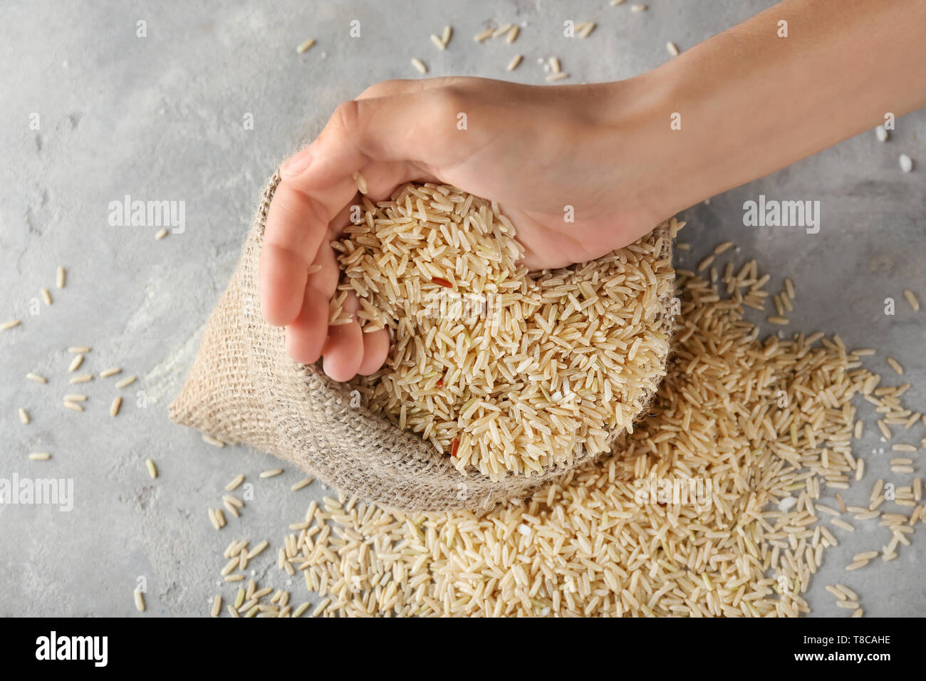 Woman taking rice from hi-res stock photography and images - Alamy