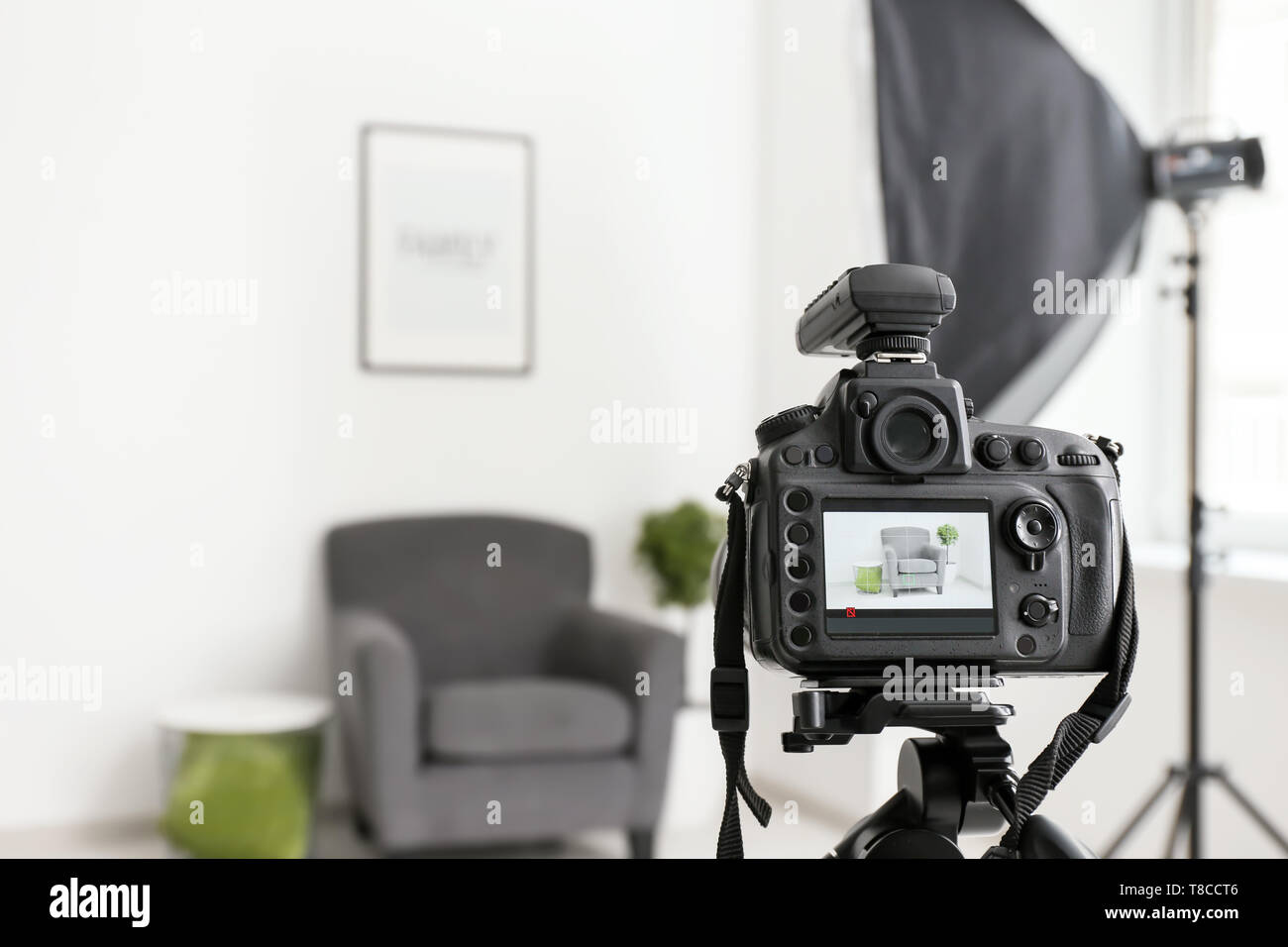 Professional camera on tripod in photo studio Stock Photo - Alamy
