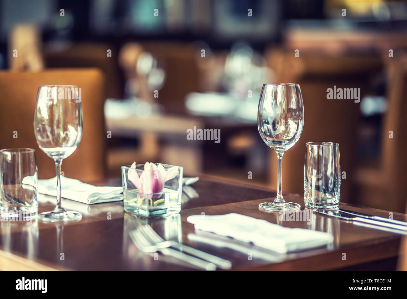 Luxury table with glasses, napkins and cutlery in restaurant or hotel