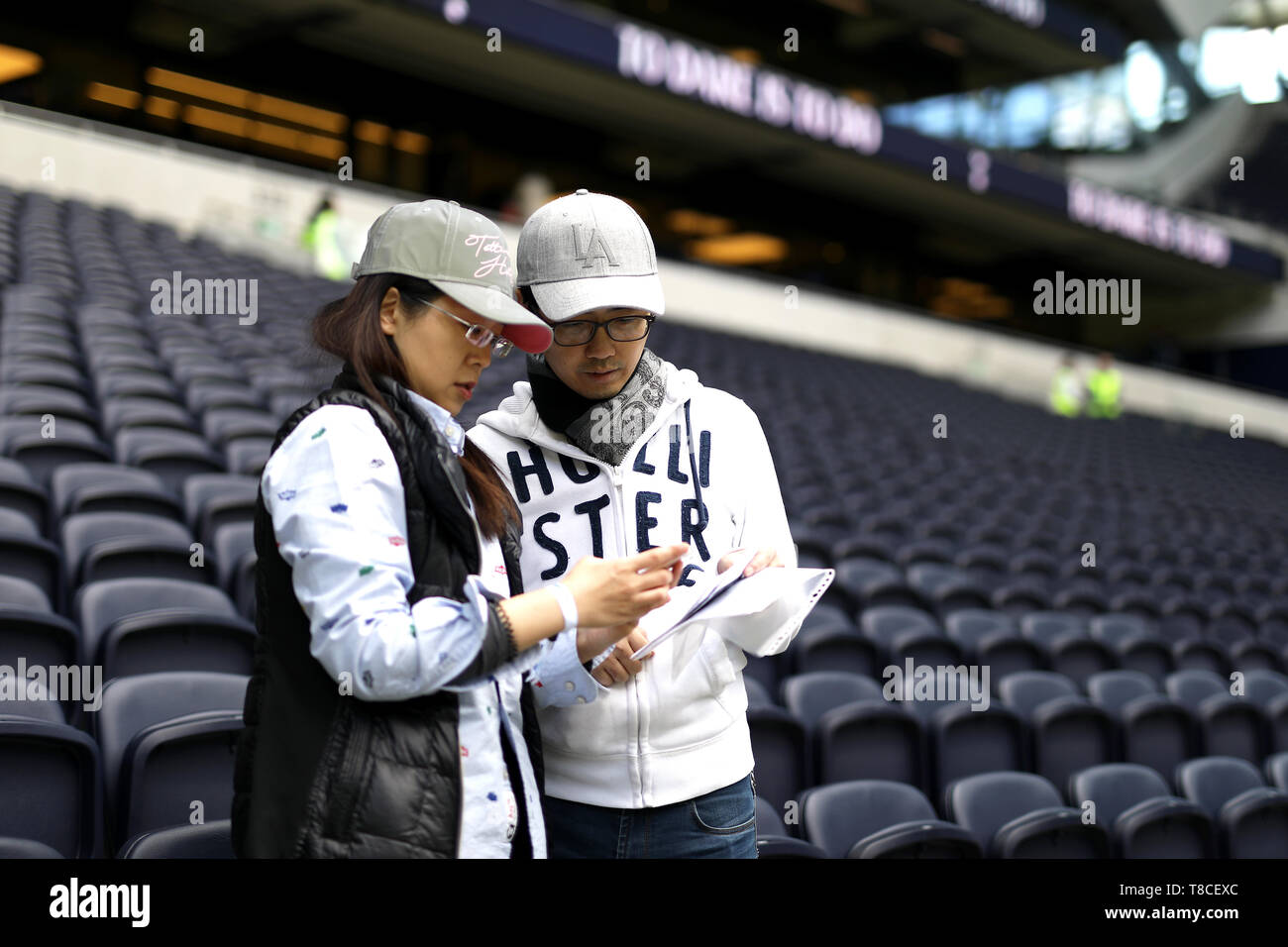 Fans arrive at the ground before the Premier League match at Tottenham Hotspur Stadium, London. Stock Photo