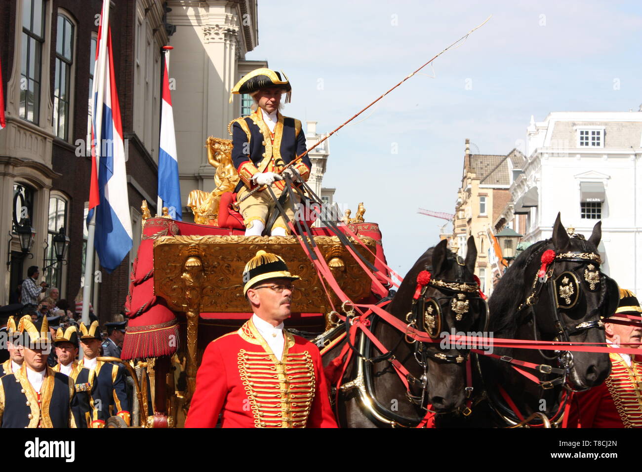 Queen Beatrix in the golden coach was escorted by the cavalry on Prinsjesdag (opening of the parliamentary year) in The Hague, South Holland, Stock Photo