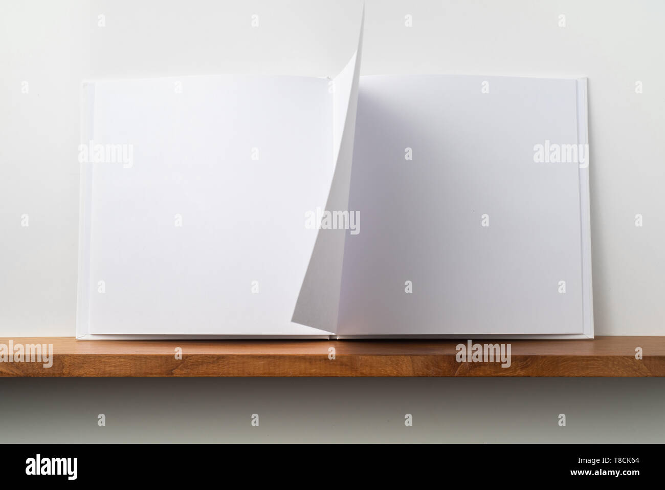 Design Concept Front View Of Open Square White Notebook On