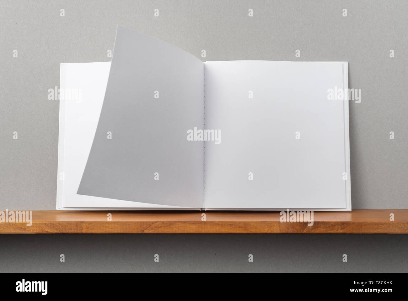 Design Concept Front View Of Opened Square White Notebook On