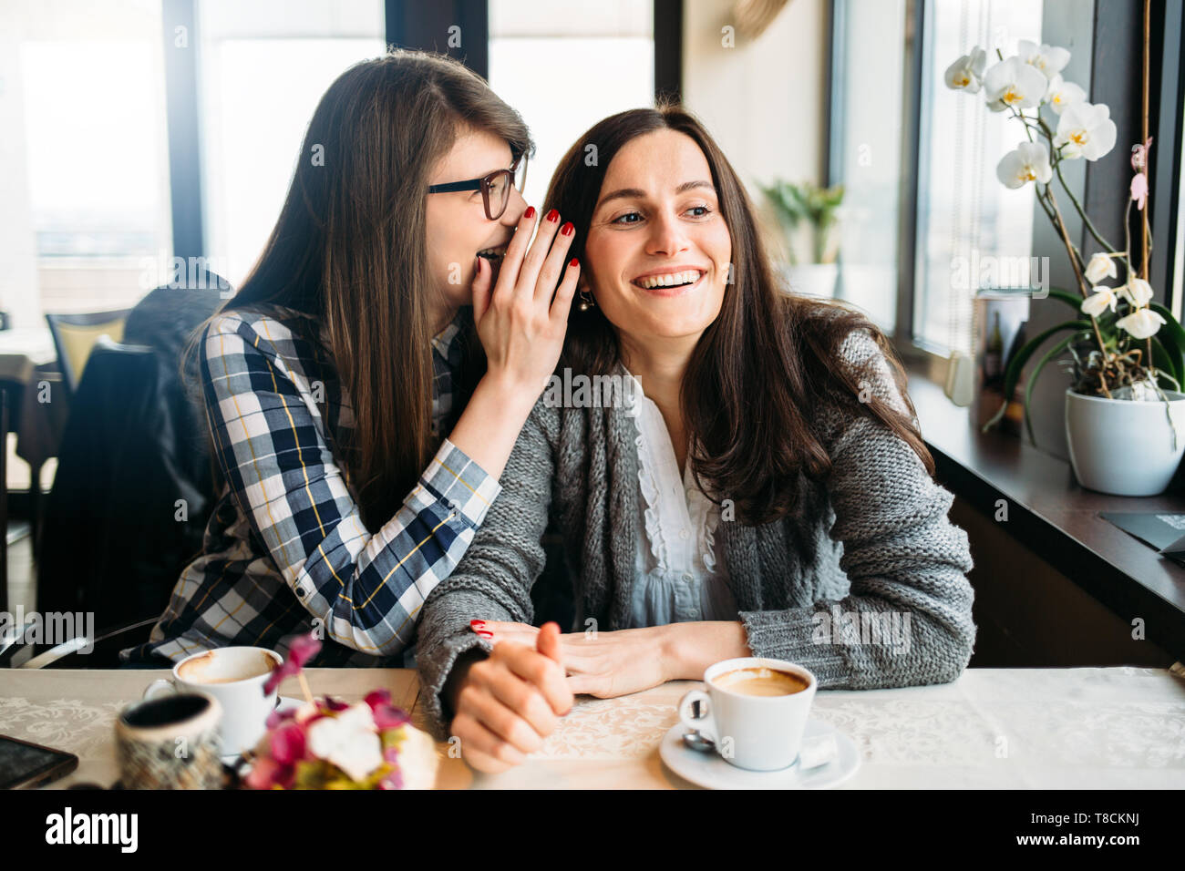 Two women sharing secret hi-res stock photography and images - Alamy