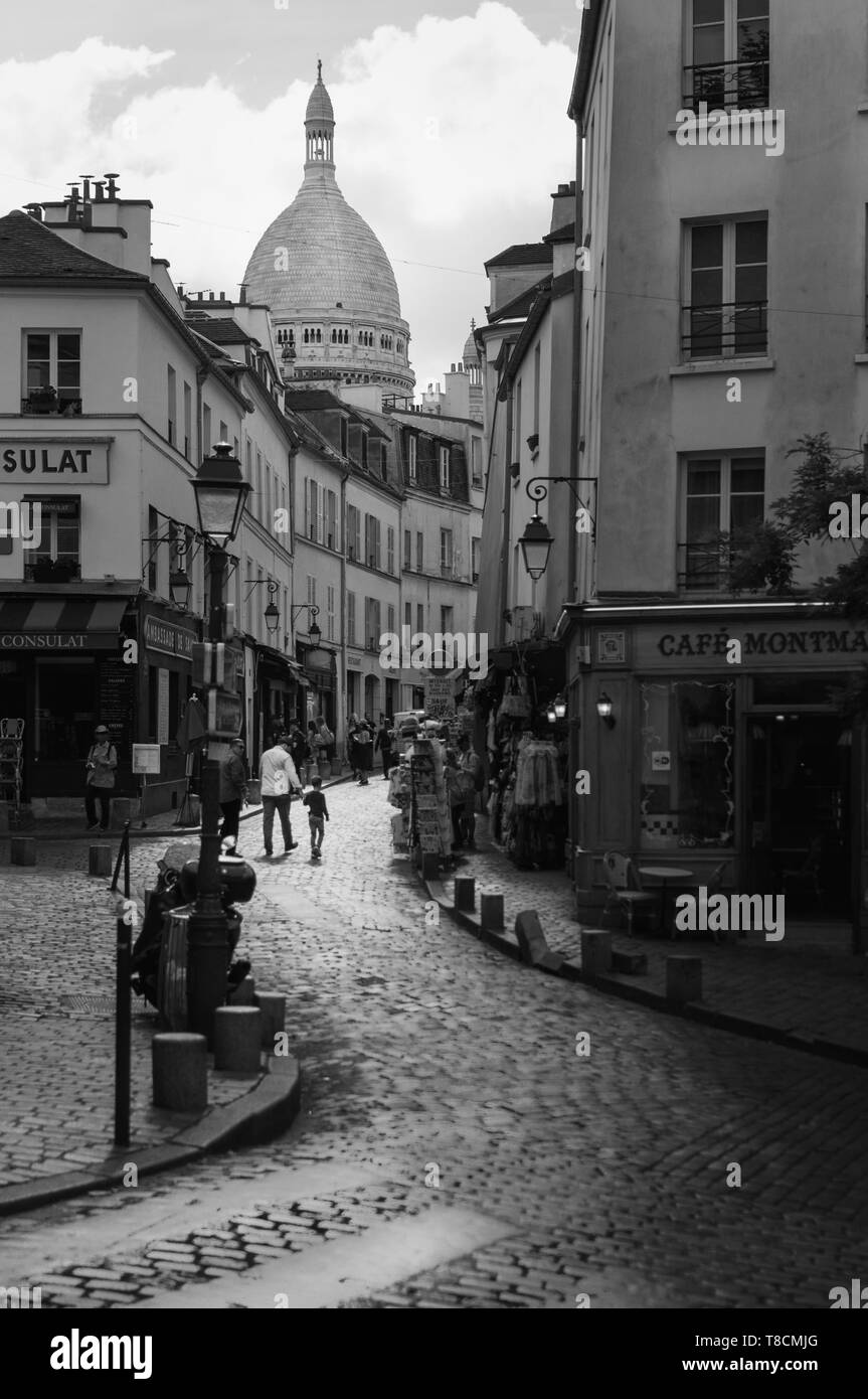 Parisian street of Montmartre leading to the Basilique du Sacred Heart in Paris - Black and White photography Stock Photo