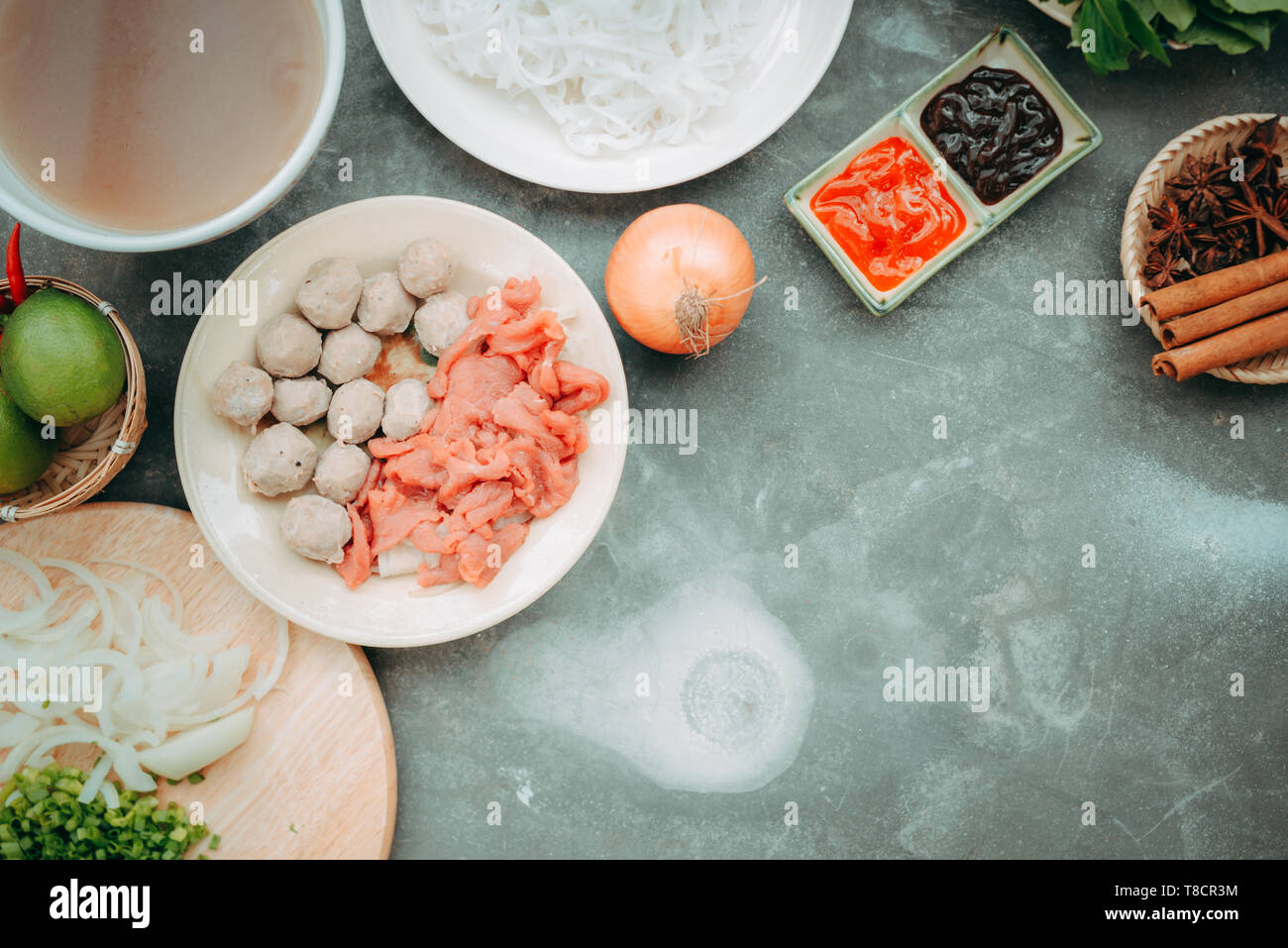 https://c8.alamy.com/comp/T8CR3M/traditional-vietnamese-noodle-soups-pho-in-bowls-concrete-background-vietnamese-beef-soup-pho-bo-close-up-asianvietnamese-food-vietnamese-dinner-T8CR3M.jpg