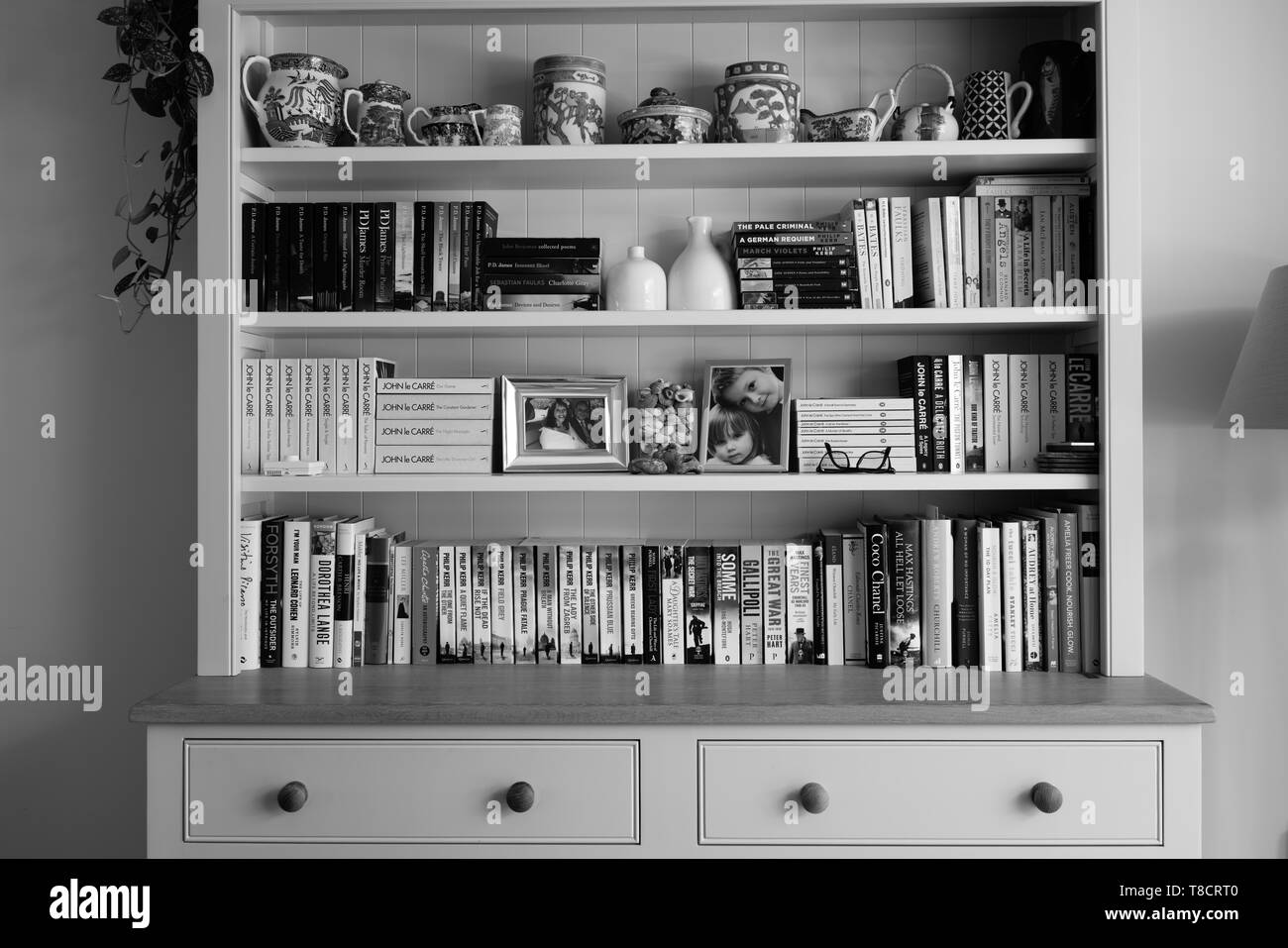 Books and ornaments in a bookcase dresser by Neptune furniture Stock Photo  - Alamy