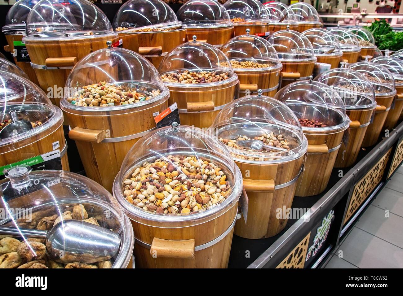 Dried fruits for sale on the market in wooden buckets with lids Stock Photo