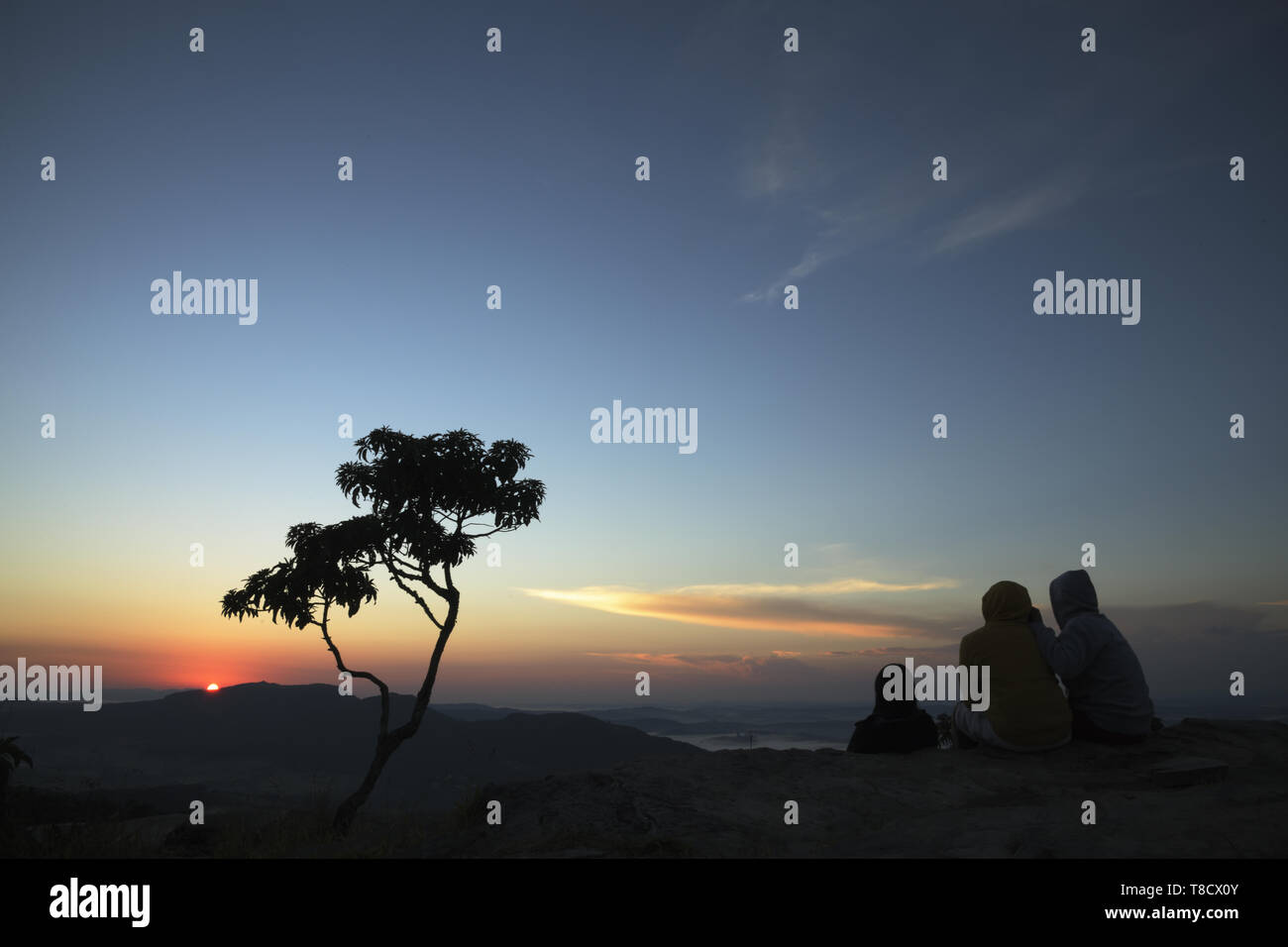 People silhouette at sunrise in Brazil Stock Photo