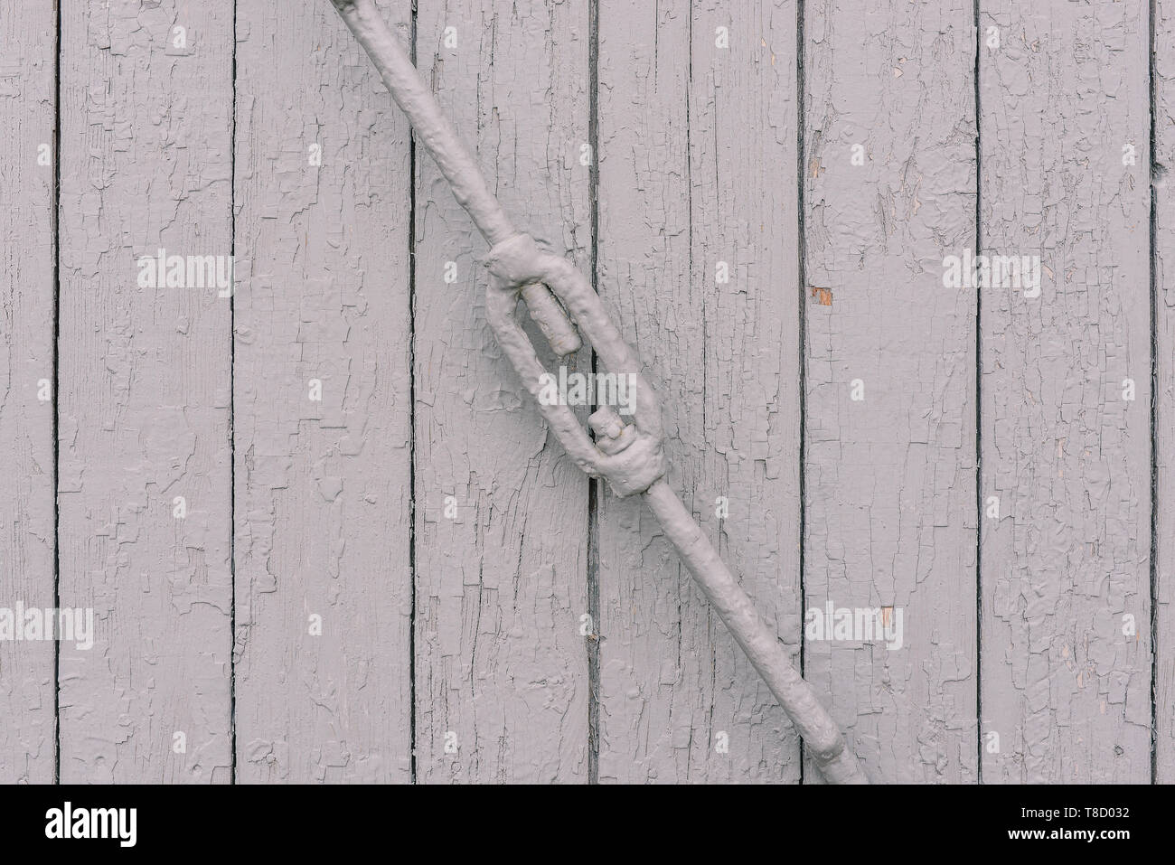 Wooden white wall. Iron shutter boards. Texture of wood. Template for