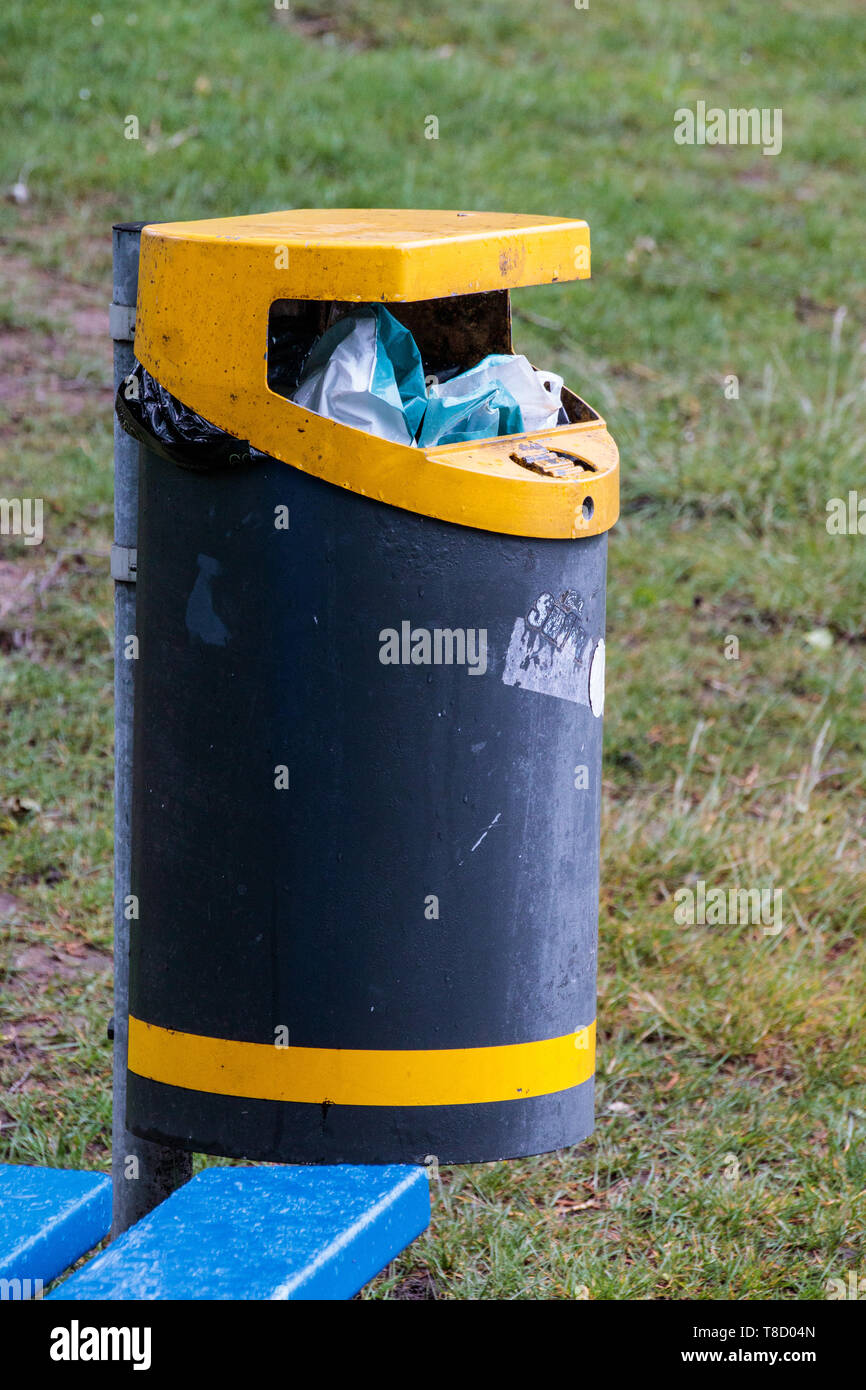 A garbage bin near the Walensee in Walenstadt nearly filled with garbage. Switzerland. Stock Photo