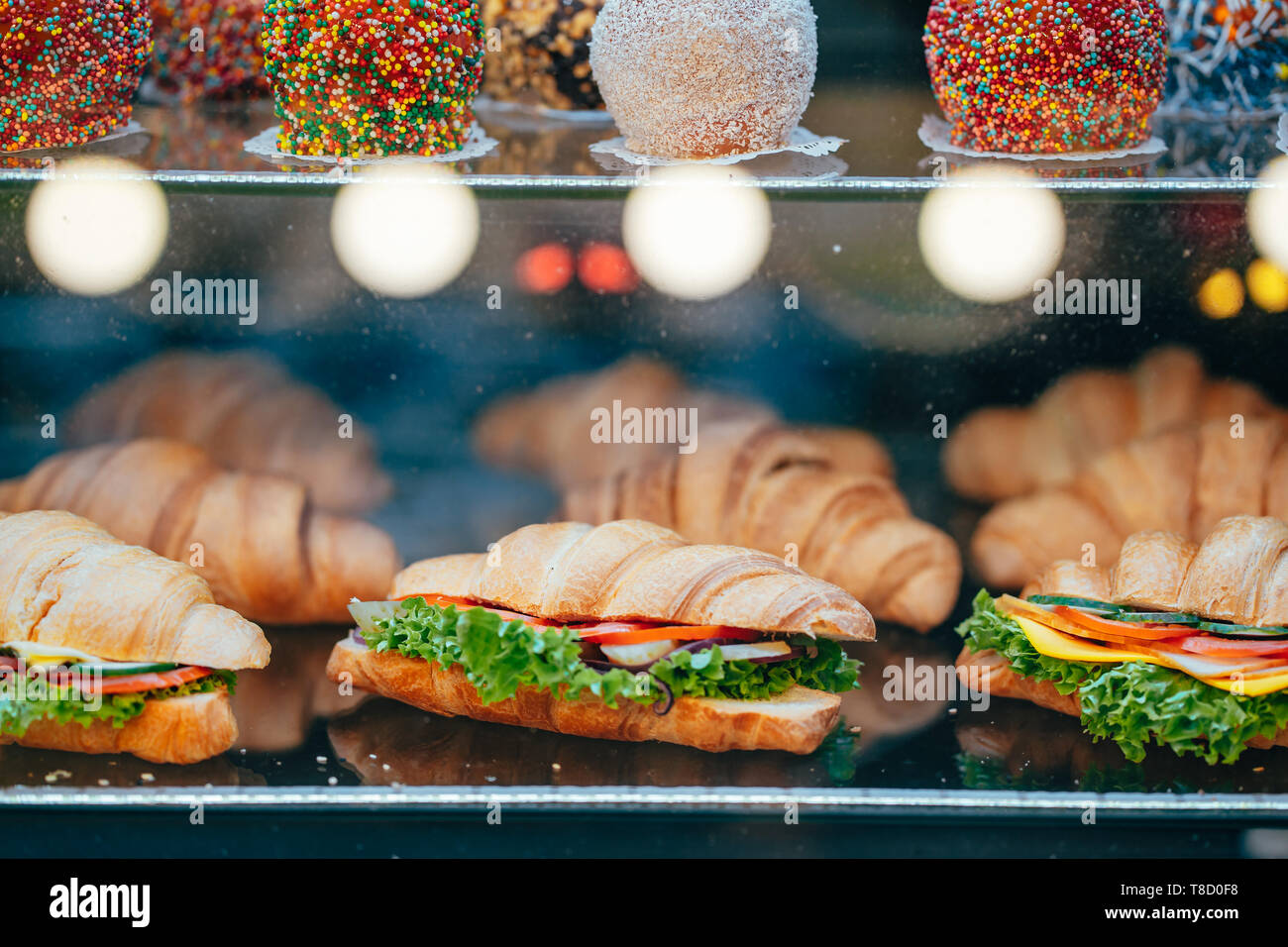 https://c8.alamy.com/comp/T8D0F8/fresh-sandwiches-with-meat-lie-on-the-display-T8D0F8.jpg