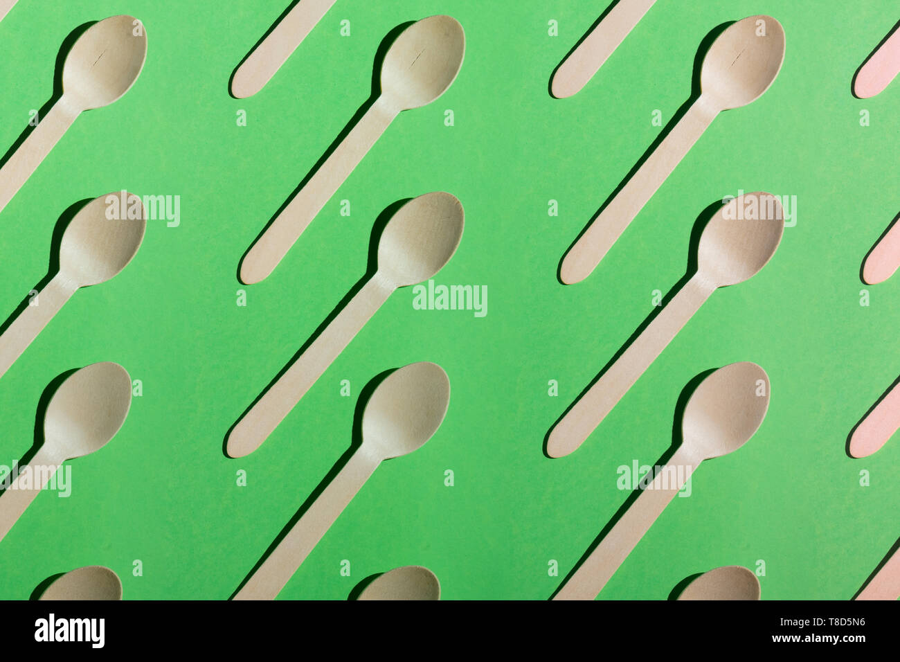 seamless pattern from spoons isolated on the green background ...