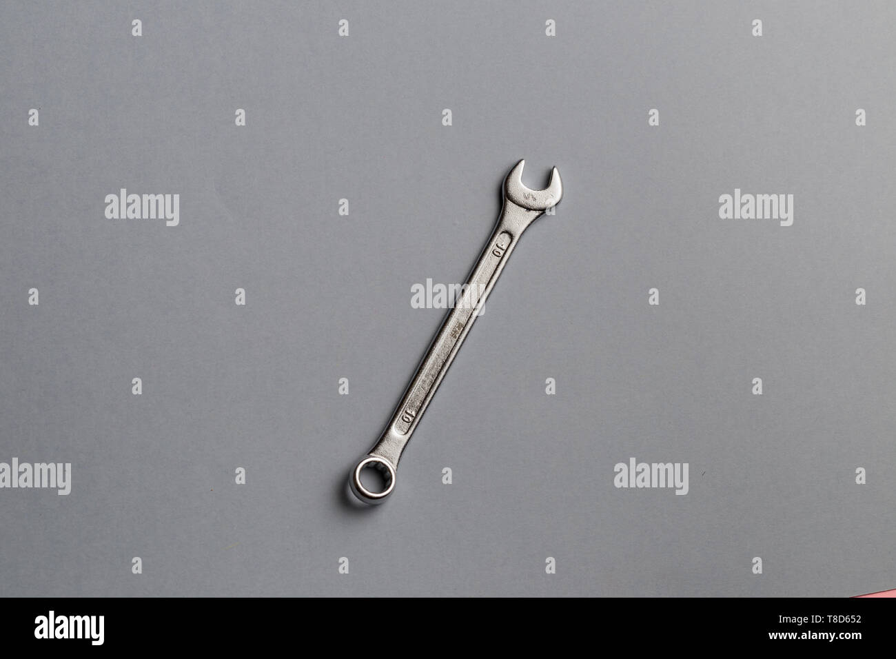 Wrench isolated on gray background. useful tool for a mechanic, copy space, Stock Photo