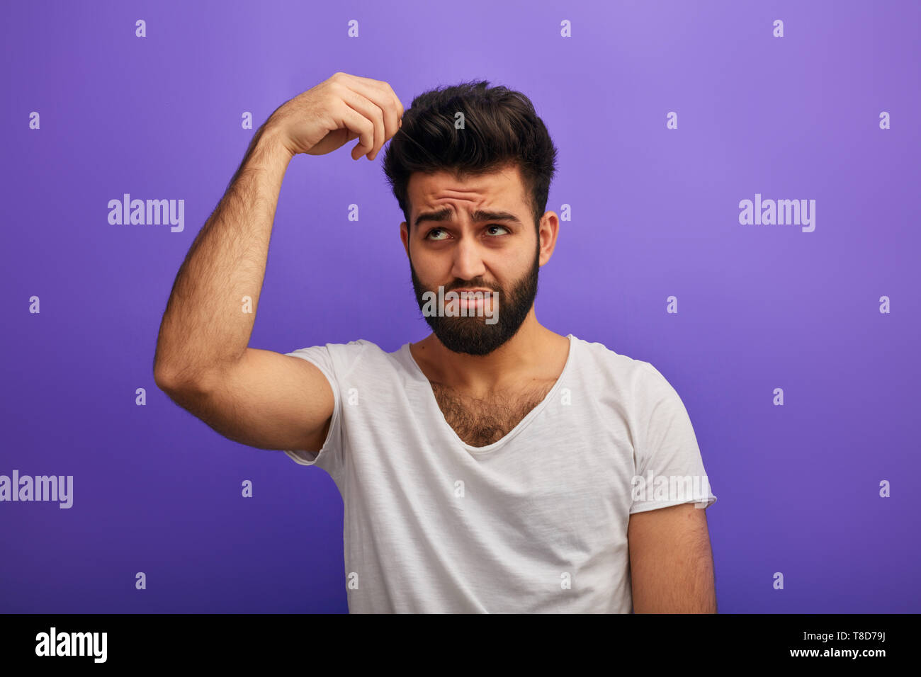 Puzzled Scared Sad Nervous Depressed Man With Beard Touching His