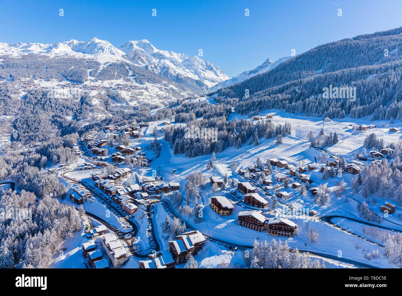 France, Savoie, Vanoise massif, valley of Haute Tarentaise, Montchavin, part of the Paradiski area, view of the Peisey Vallandry ski area and the Mont Pourri (3779m) (aerial view) Stock Photo