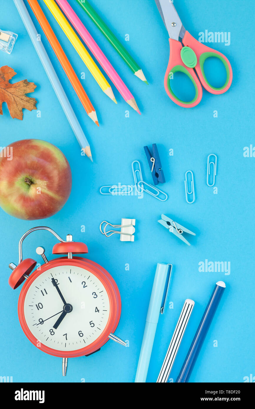 Creative flat lay top view back to school concept with alarm clock ...
