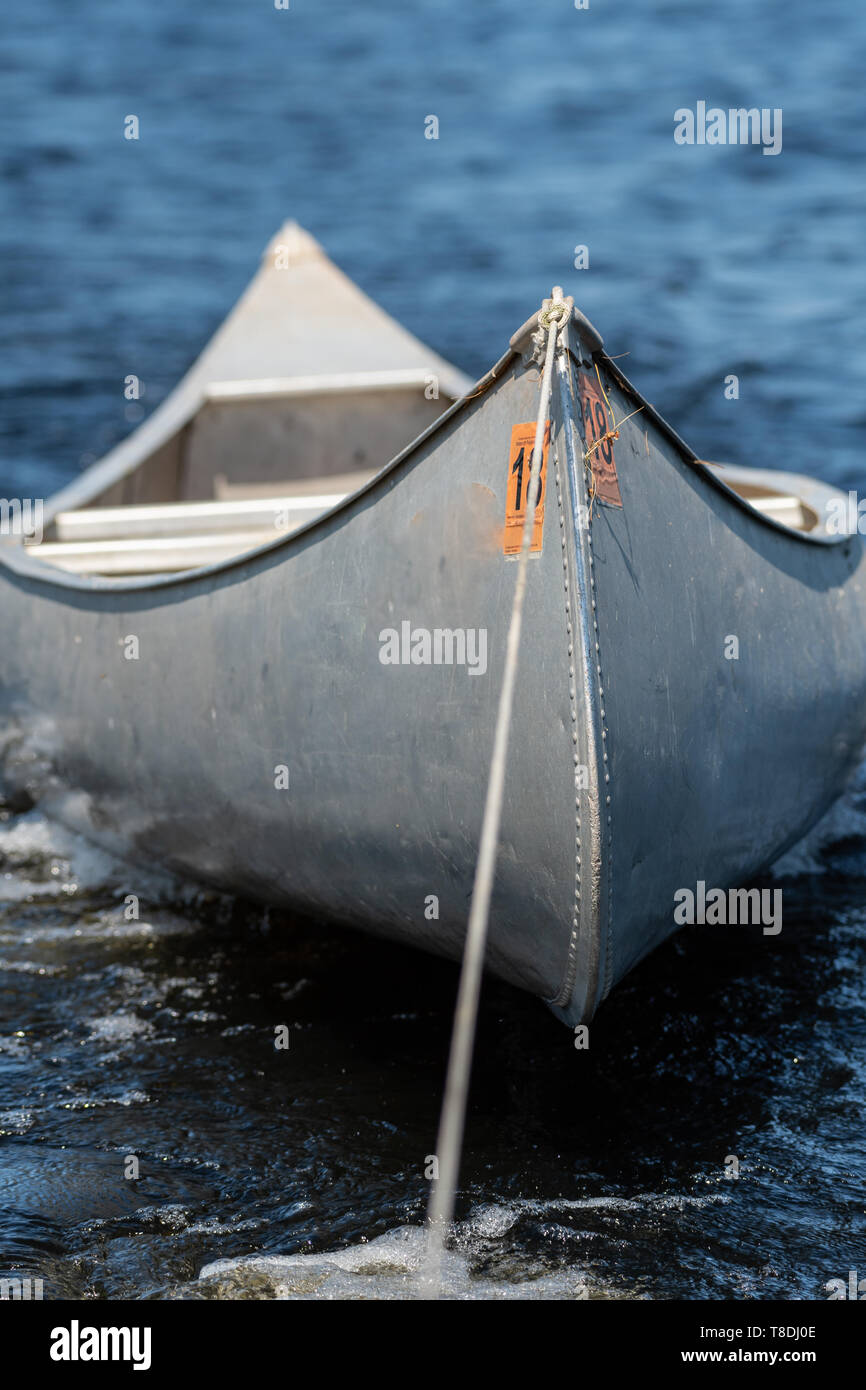 Towing Aluminum Canoe Across Large Minnesota Lake Stock Photo Alamy