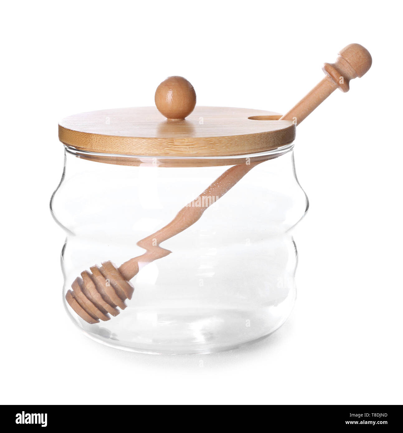 Glass jar with honey dipper on white background Stock Photo Alamy