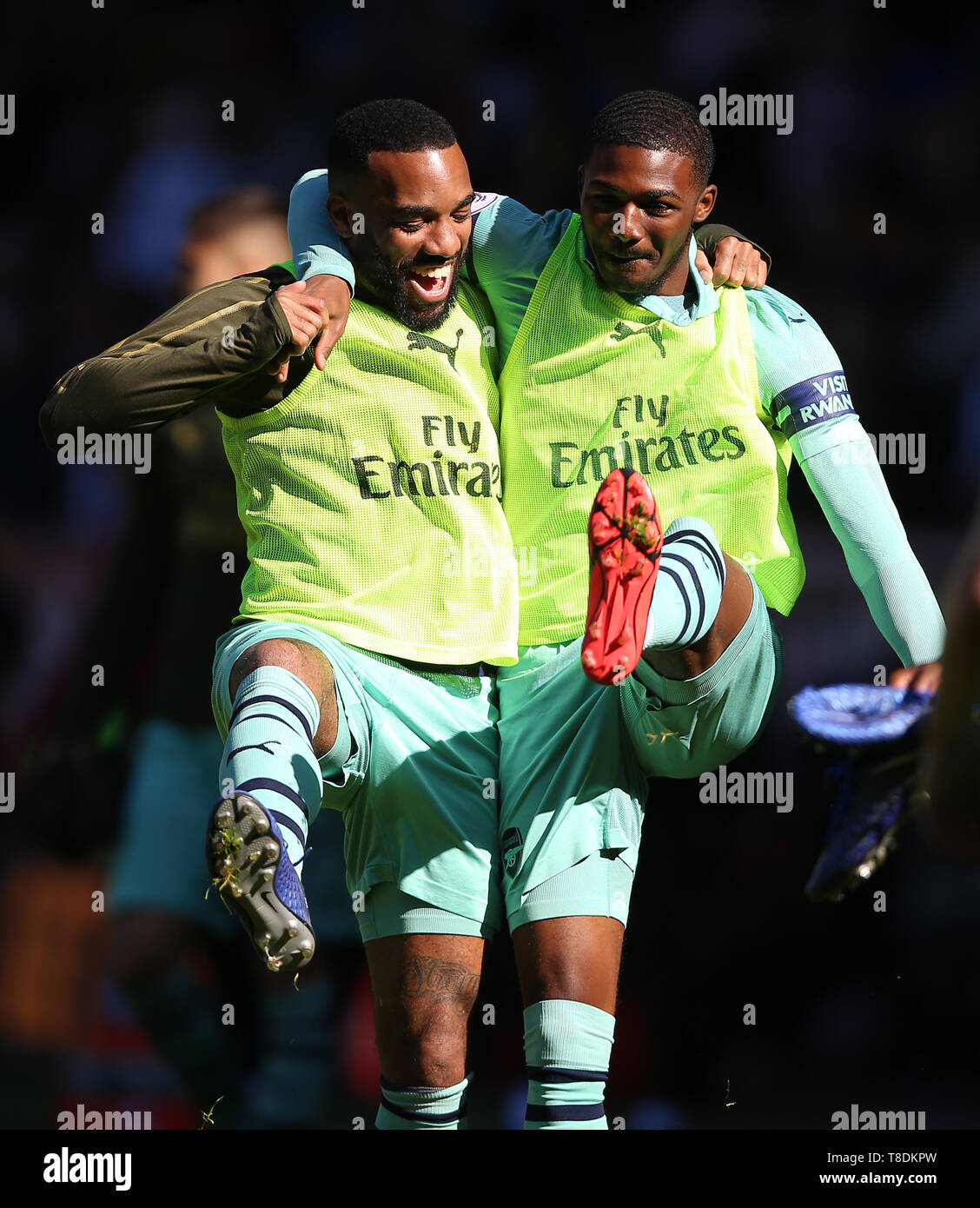 Arsenal's Alexandre Lacazette (left) and Arsenal's Ainsley Maitland ...