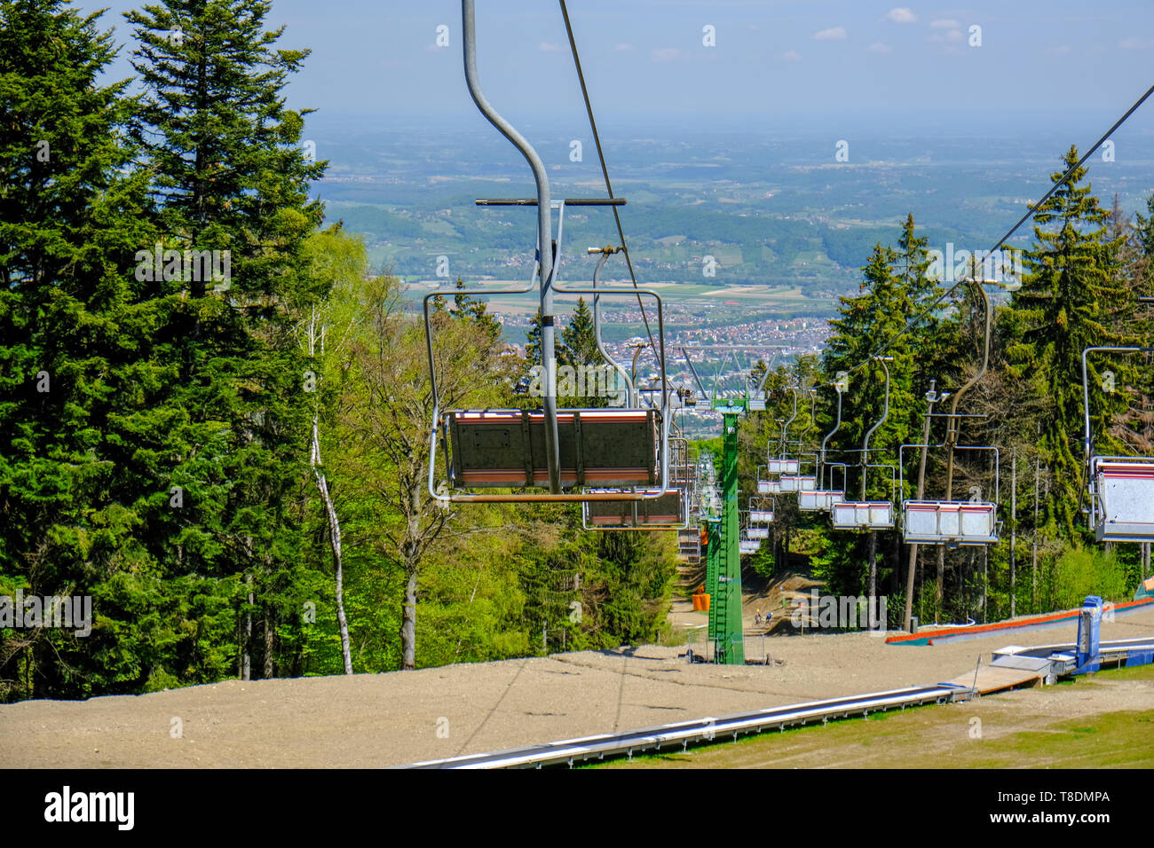 Empty ski lift in the summer, preparation for winter skiing season, ski slopes outside winter season Stock Photo