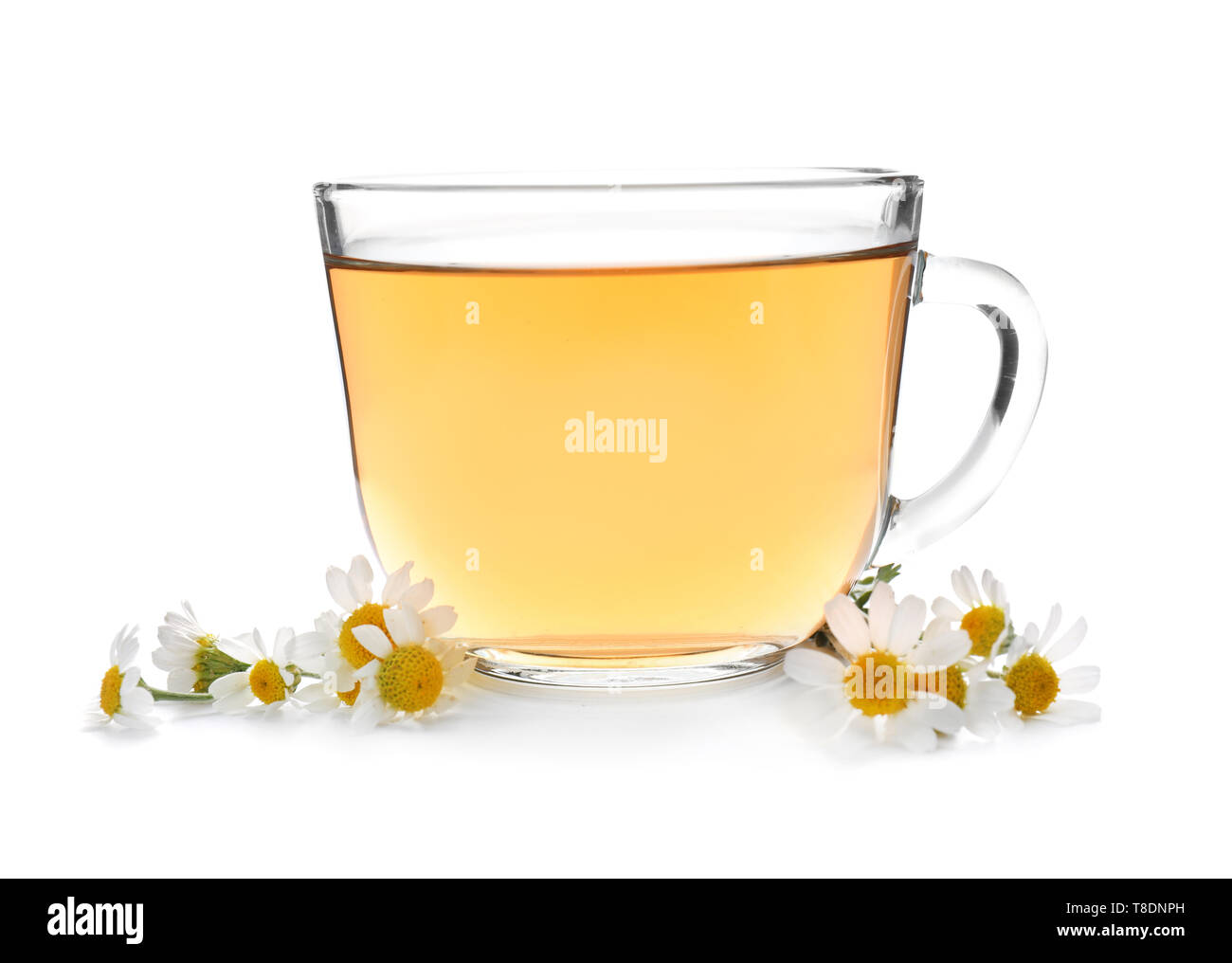 Glass cup of delicious camomile tea on white background Stock Photo - Alamy