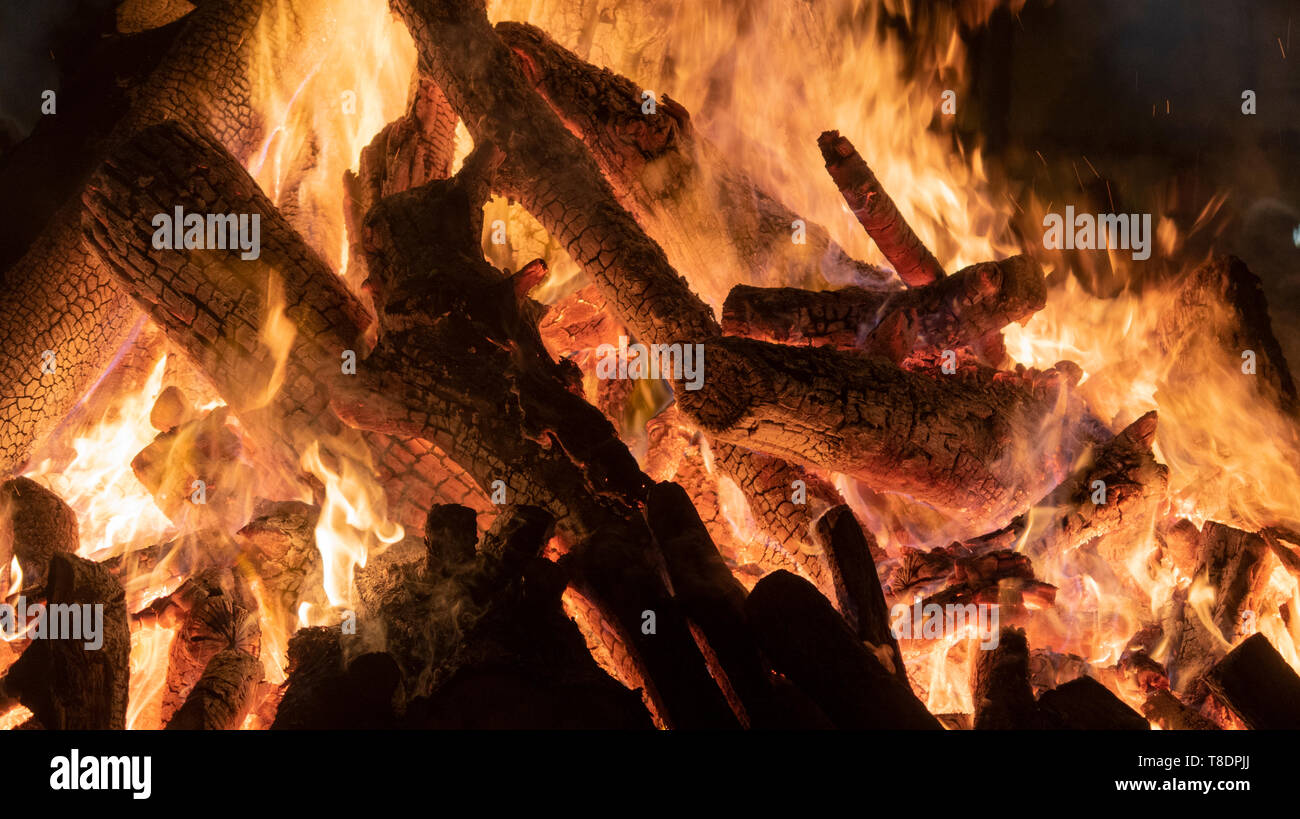 Wood bonfire background. Burning wood. Festivity of the summer solstice in Catalonia. Summer entrance. beginning of summer vacation. Stock Photo
