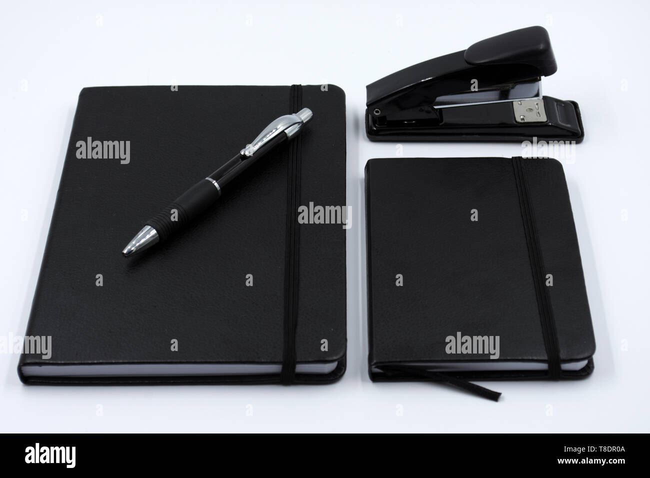 Office supplies on white background. Back to work. notebooks and black pens. Back to school Stock Photo