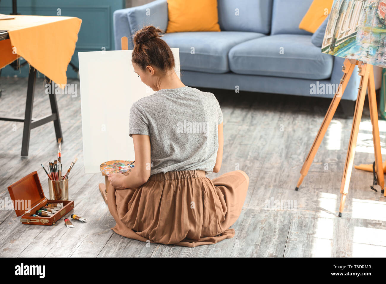 Artist female paints masterpiece sitting hi-res stock photography and ...