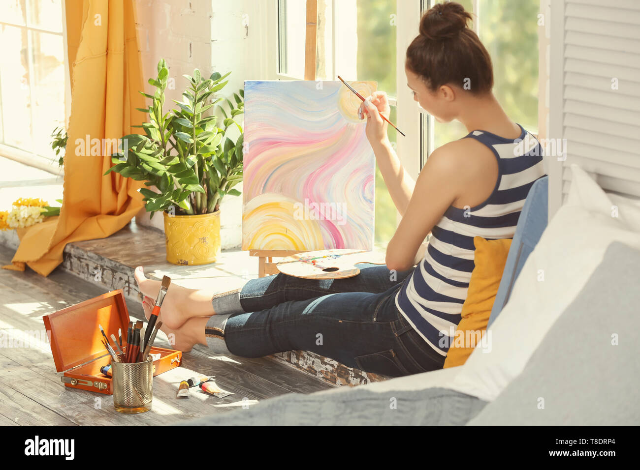 Artist female paints masterpiece sitting hi-res stock photography and ...