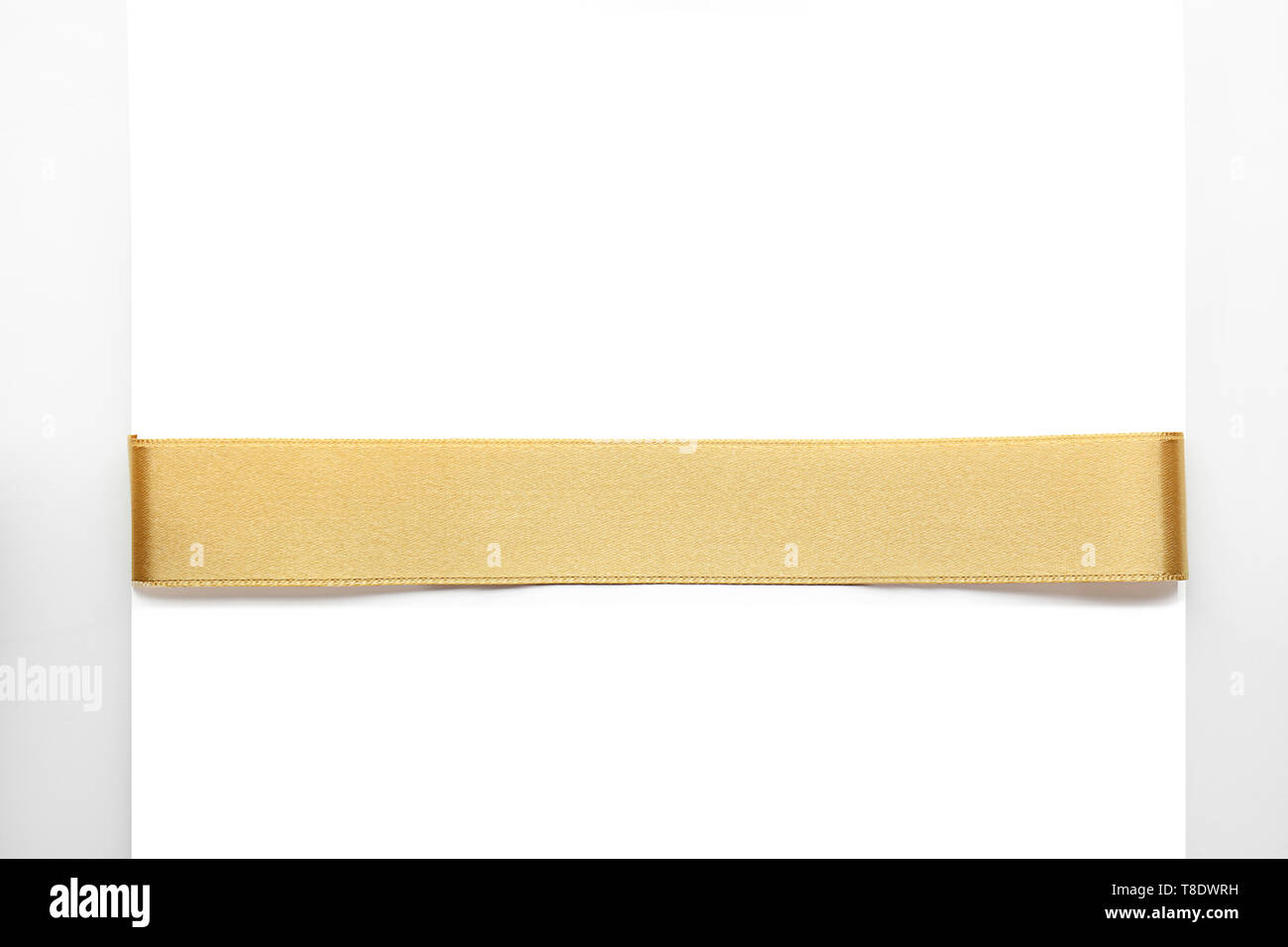 Beautiful golden ribbon with blank card on white background Stock Photo ...